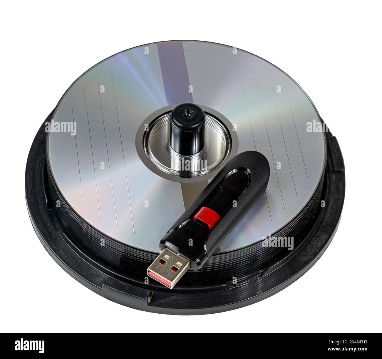 Horizontal close-up shot of a high capacity USB Flash On Stack of CD Discs. Stock Photo