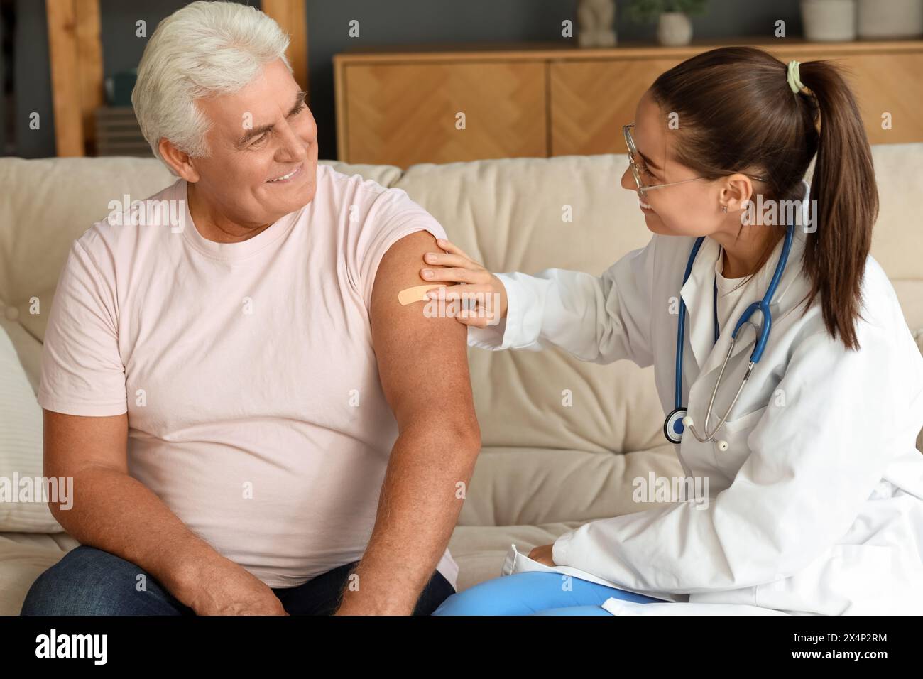 Nurse putting a plaster hi-res stock photography and images - Alamy