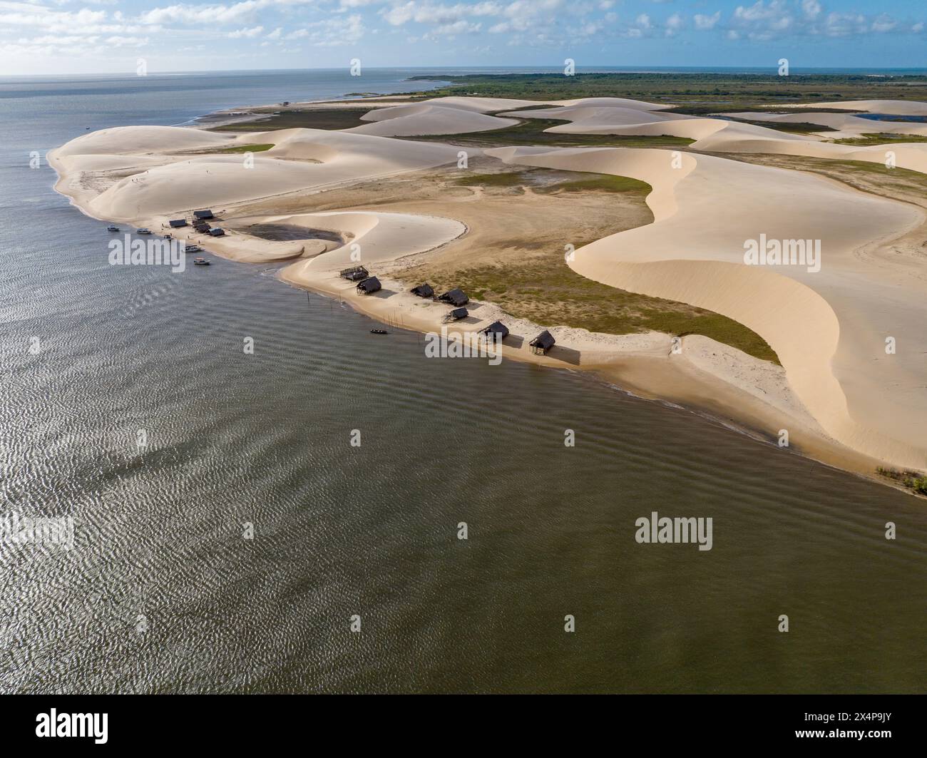 Aerial view of Parque da Dunas - Ilha das Canarias, Brazil. Huts on the Delta do Parnaíba and Delta das Americas. Lush nature and sand dunes. Boats Stock Photo