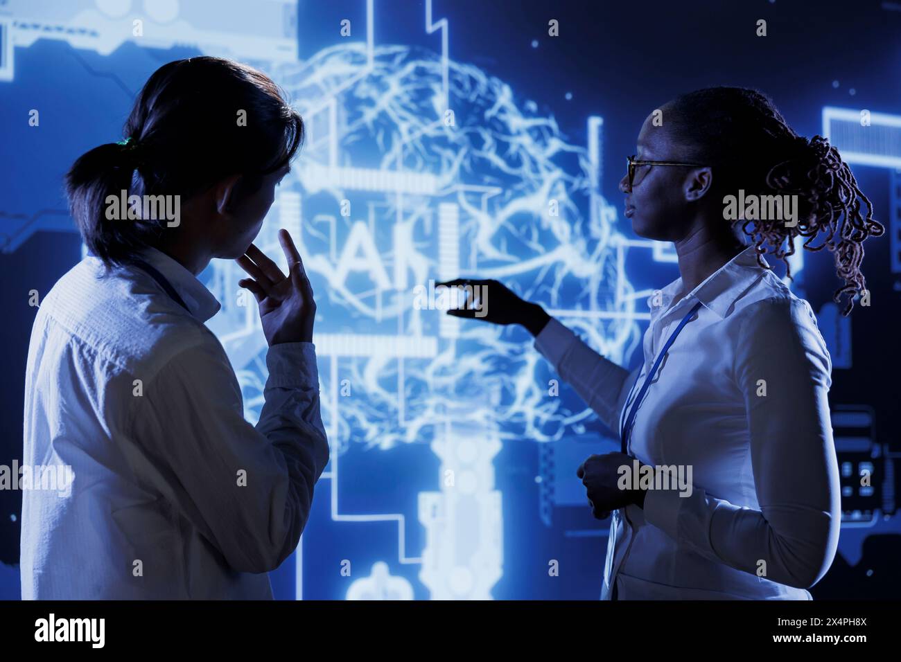 Certified engineers brainstorm ways to use AI cognitive computing to extract usable information from complex data. Teamworking experts implement artificial intelligence to process massive datasets Stock Photo