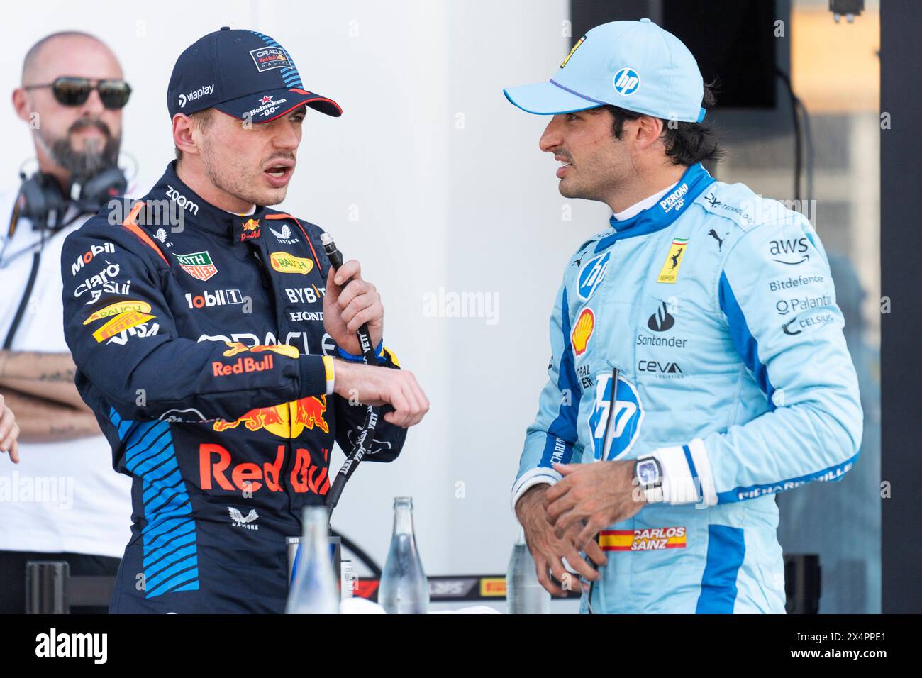 Miami Gardens, United States. 04th May, 2024. Dutch Formula One driver Max Verstappen of Red Bull Racing speaks with Spanish Formula One driver Carlos Sainz Jr. of Scuderia Ferrari following qualifying for the Formula One Miami Grand Prix at the Miami International Autodrome in Miami Gardens, Florida on Saturday, May 4, 2024 Photo by Greg Nash/UPI. Credit: UPI/Alamy Live News Stock Photo