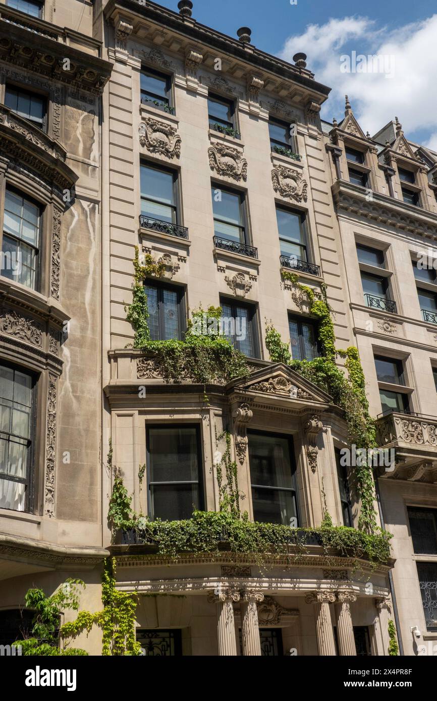 Luxury homes along E. 67th St. in the Upper Eastside Historic District on a sunny spring afternoon, 2024, New York City, USA Stock Photo