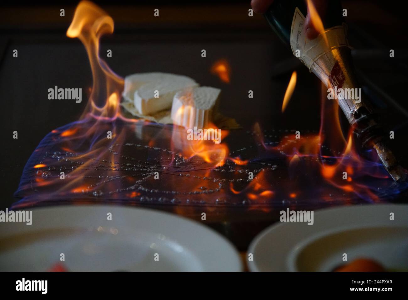 chef's hands with spatula over teppanyaki. cooking vegetables meat and