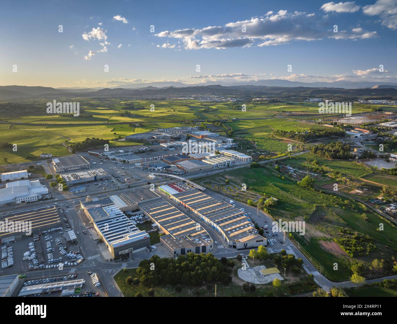 Aerial view of the Sant Isidre industrial estate, in Sant Fruitós de Bages, on a spring sunset (Bages, Barcelona, Catalonia, Spain) Stock Photo