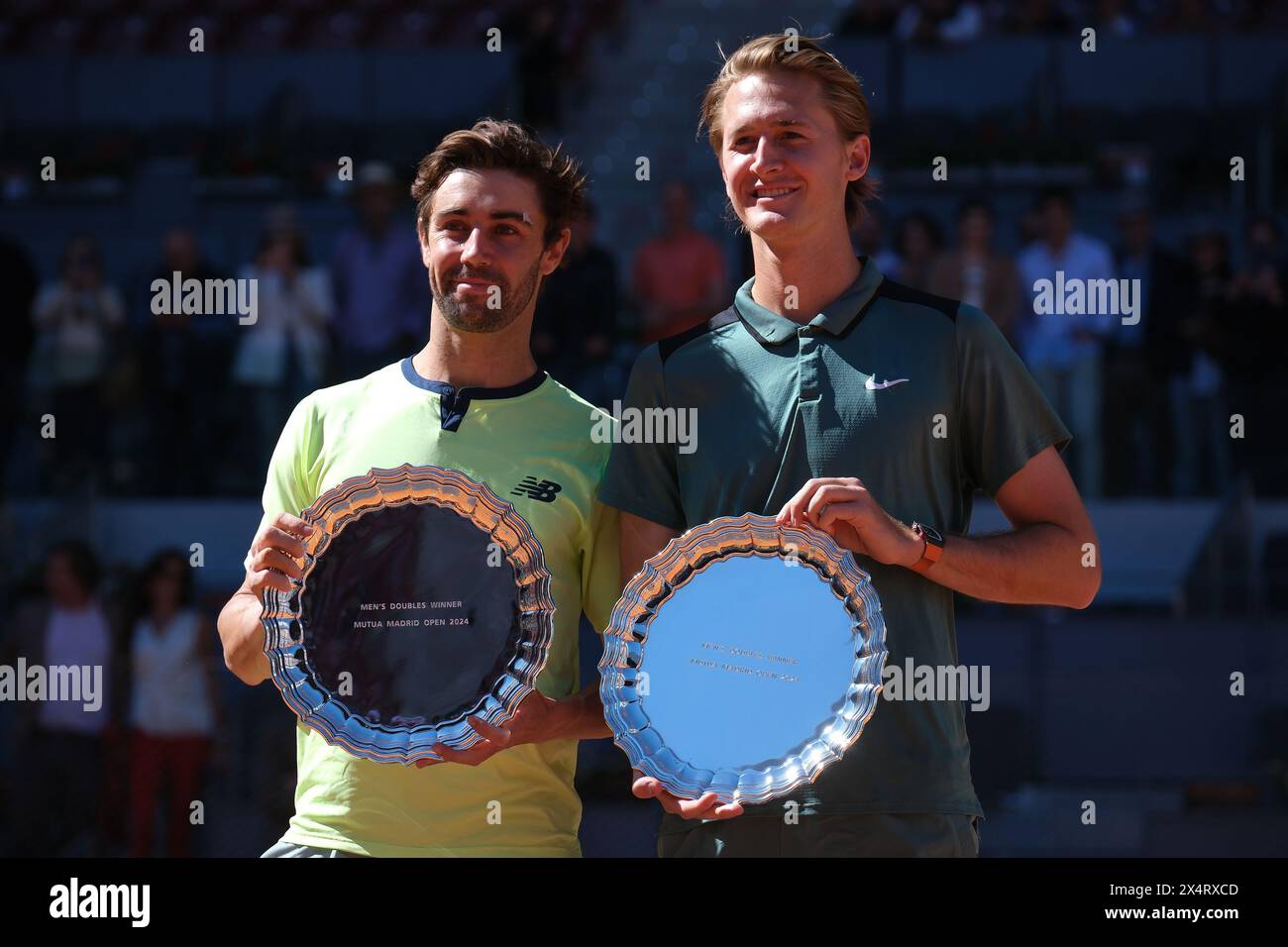 Jordan Thompson and Sebastian Korda  pose for with their Mutua Madrid Open Men's Doubles trophies following victory  during the  Doubles Final match a Stock Photo