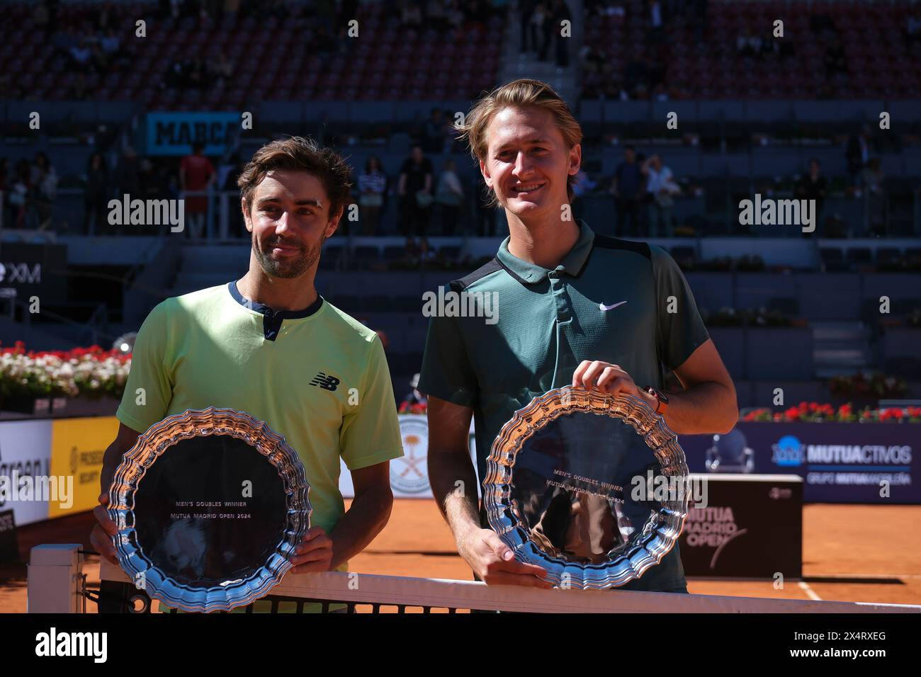 Jordan Thompson and Sebastian Korda  pose for with their Mutua Madrid Open Men's Doubles trophies following victory  during the  Doubles Final match a Stock Photo
