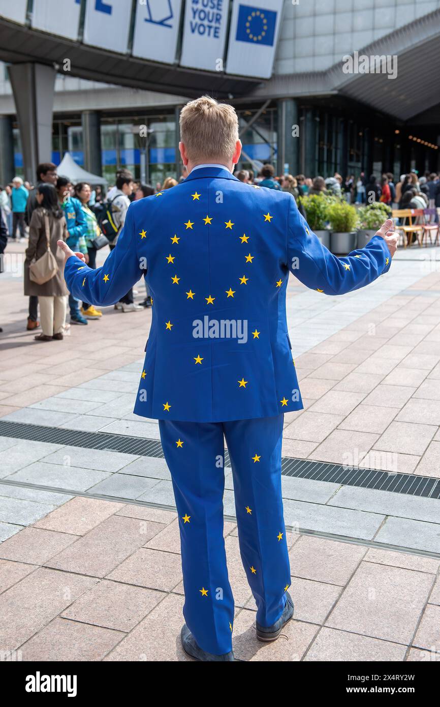 Candidate for the EP elections Jacob Stryhn from Denmark in his European star suit during an open day to celebrate the birthday of the European Parliament in Brussels. Celebrating the European Parliament's birthday in Brussels, visitors gained special access to the Parliament chambers and the iconic building itself. The open day featured informative stands on the upcoming European Parliament elections, fostering political engagement and dialogue. Against the backdrop of European democracy, attendees immersed themselves in the legislative process, symbolizing transparency and civic participati Stock Photo