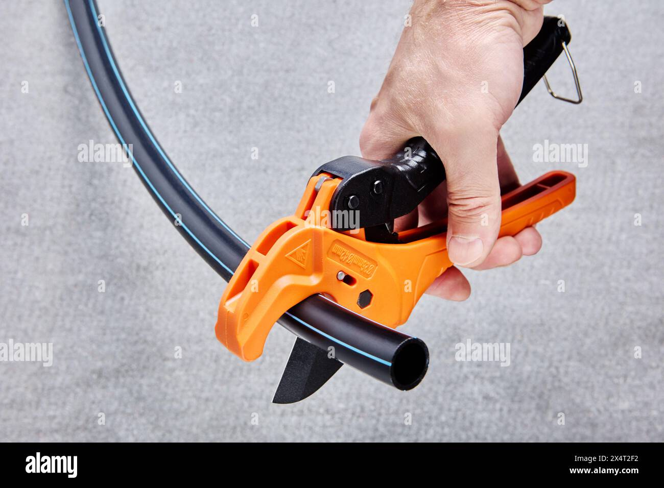 PVC pipe tubing cutter, one hand ratchet pipe cutting tool for plastic pipes, on gray background