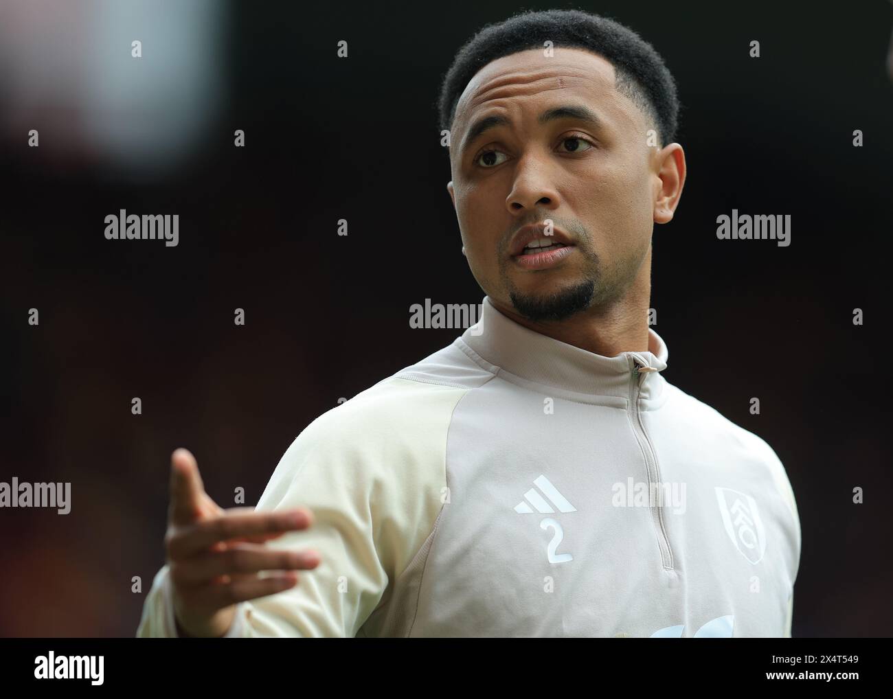 London, UK. 4th May, 2024. Kenny Tete of Fulham warms up before the Premier League match at Gtech Community Stadium, London. Picture credit should read: Paul Terry/Sportimage Credit: Sportimage Ltd/Alamy Live News Stock Photo