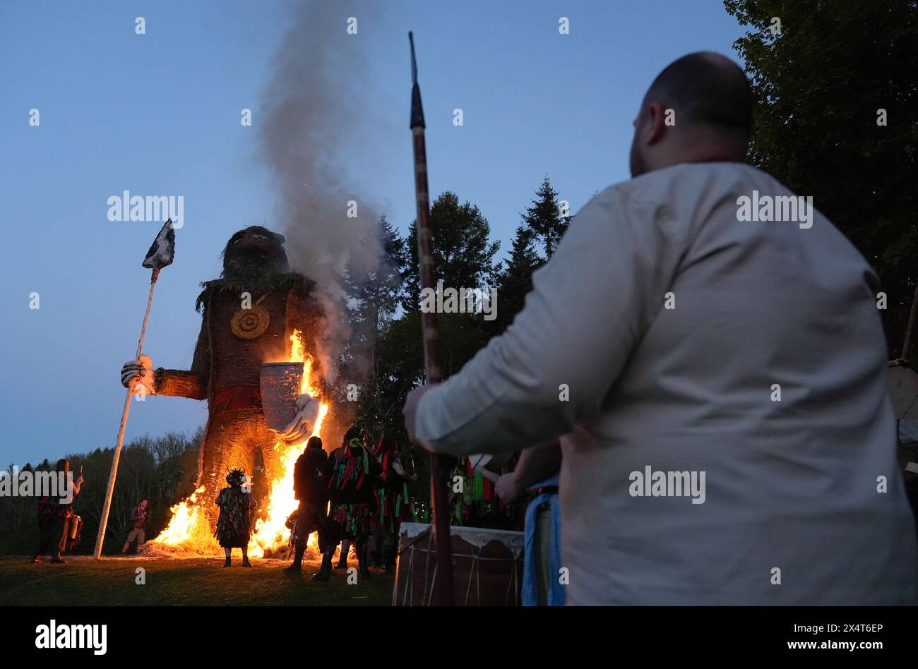 Deltic Fire Members of the Pentacle Drummers perform in front of a burning wicker ...