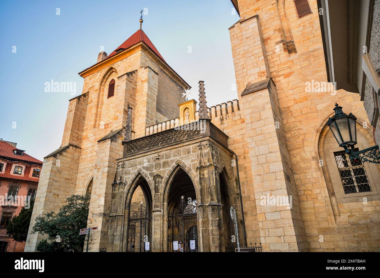 Entrance to medieval Johannine Commandery, gothic portal with two doors and towers, historical monument from 1169. Prague, Czech republic. Stock Photo
