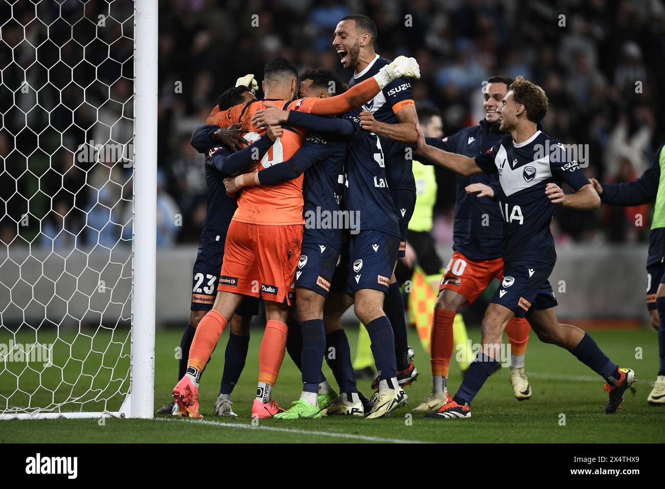 MELBOURNE, AUSTRALIA. 5 May 2024. Pictured: Portuguese Roderick Miranda(21) of Melbourne Victory leaps into the crowd of Victory players hugging Paul Izzo(20) of Melbourne Victory after beating Melbourne City 3-2 on penalties during the A Leagues Soccer, Melbourne Victory FC v Melbourne City FC elimination series at Melbourne's AAMI Park. Credit: Karl Phillipson/Alamy Live News Stock Photo