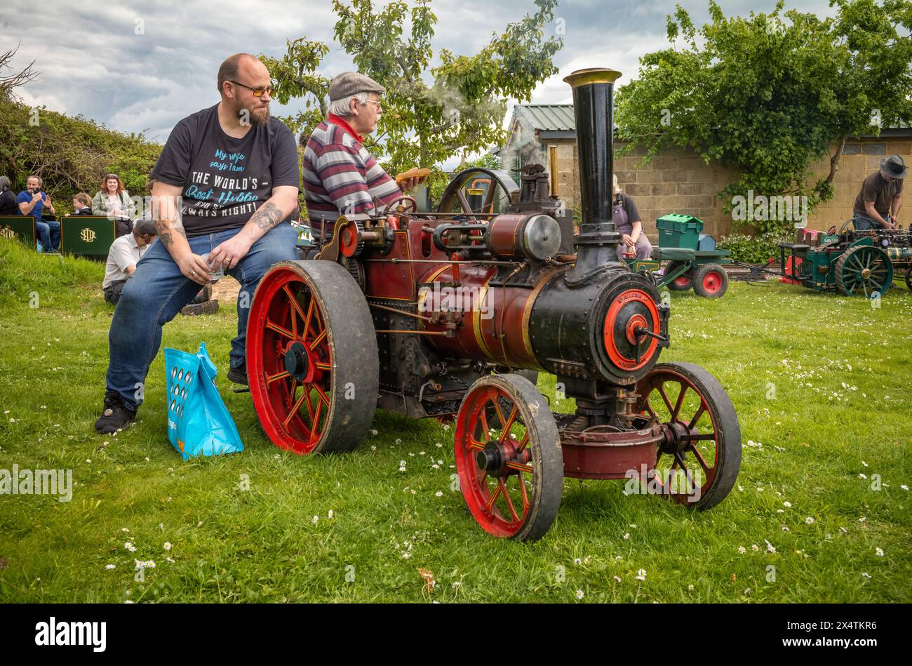 Enthusiasts with their miniature steam-powered traction engine at South Downs Steam Railway, Pulborough, West Sussex, UK. Stock Photo