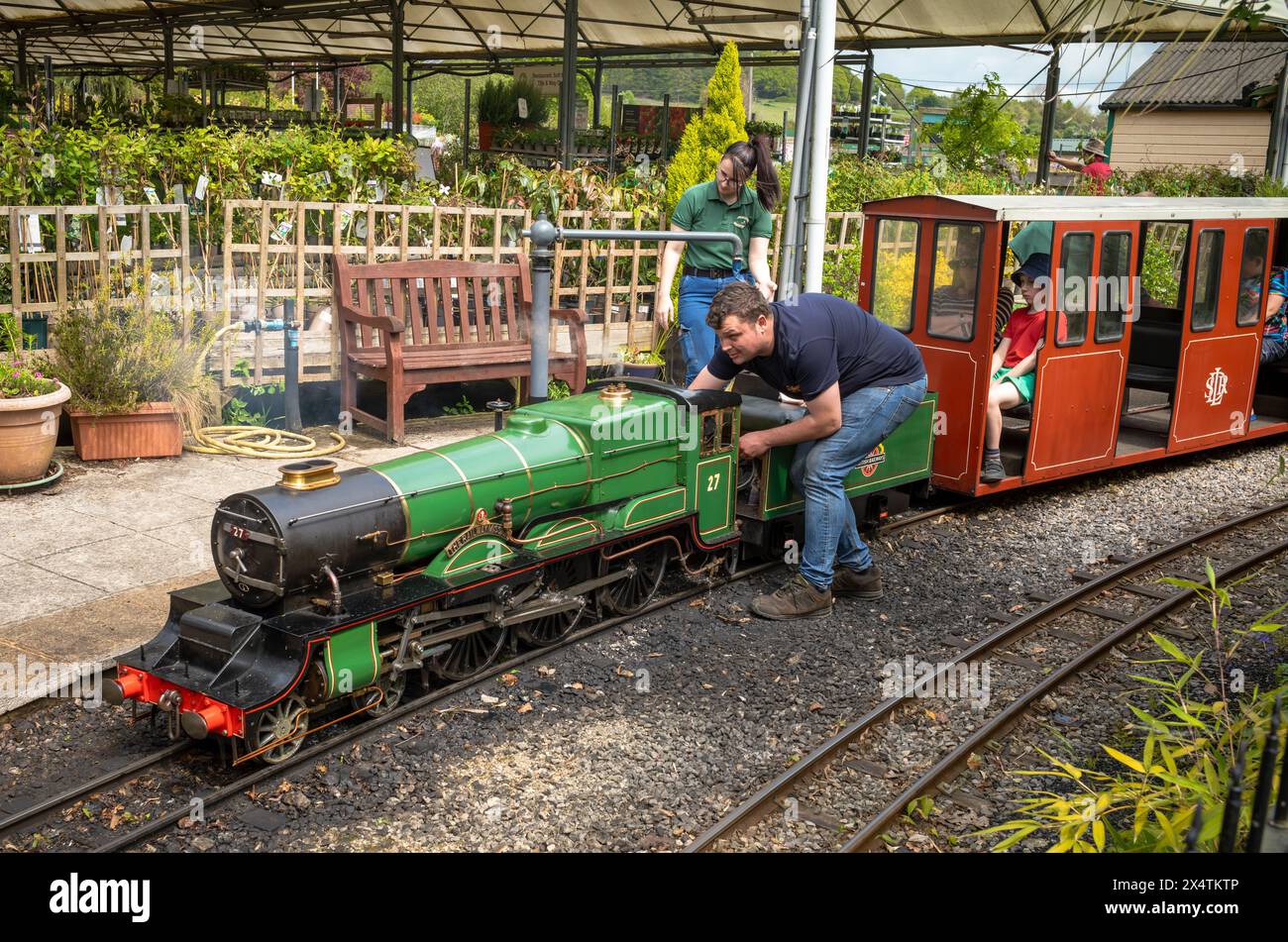 Volunteers ready The Railway Mission minature steam locomotive and its carriages at South Downs Light Railway, Pulborough, UK Stock Photo