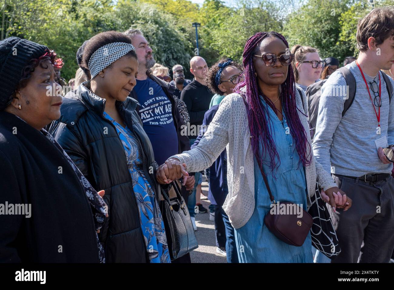 People attend a vigil at Hainault Underground Station Car Park, north east London, in memory of 14-year-old Daniel Anjorin, who was killed in a sword attack on Tuesday, that saw four others injured, including two Metropolitan Police officers. Picture date: Sunday May 5, 2024. See PA story POLICE Hainault. Photo credit should read: Jeff Moore/PA Wire Stock Photo