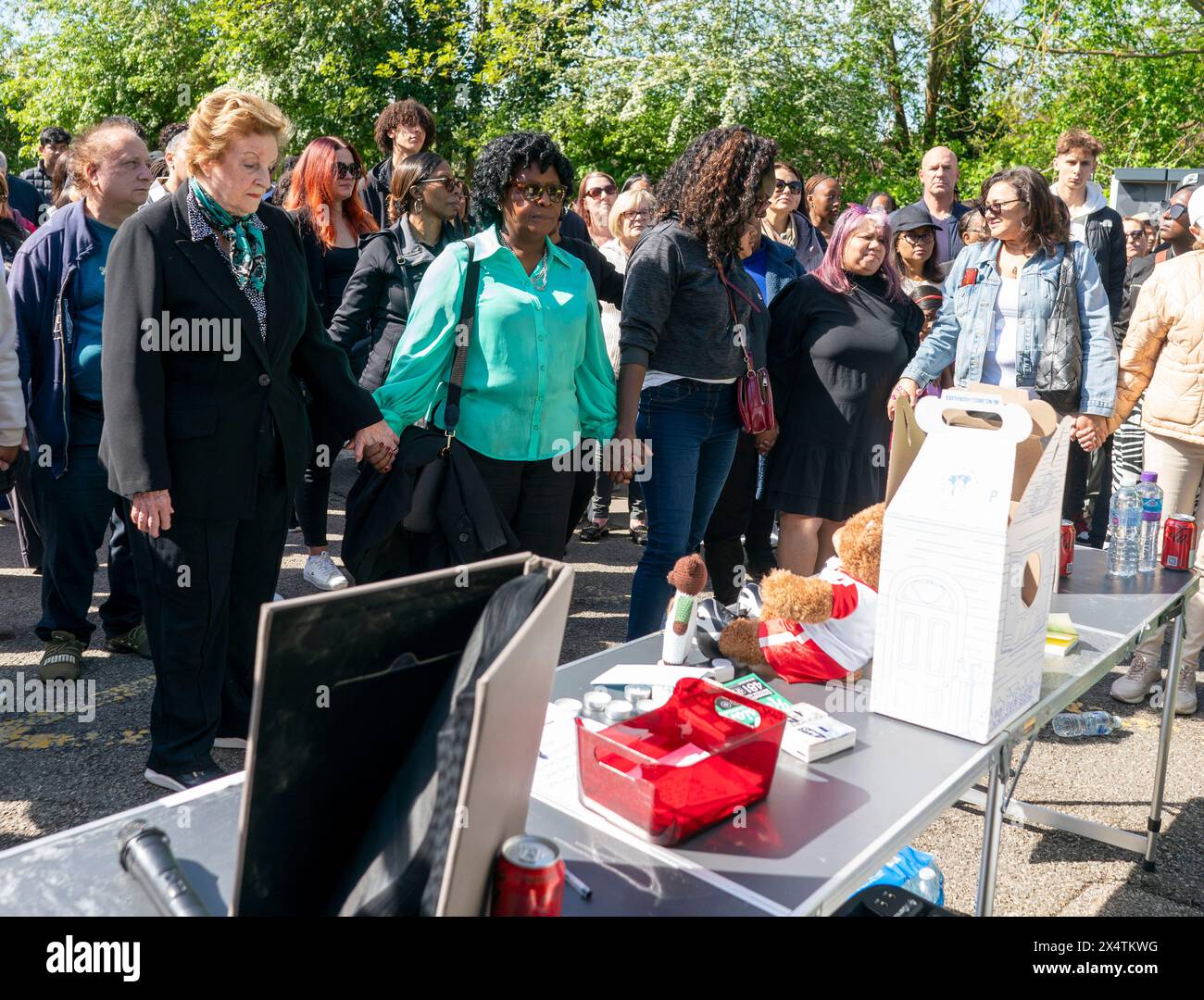 People attend a vigil at Hainault Underground Station Car Park, north east London, in memory of 14-year-old Daniel Anjorin, who was killed in a sword attack on Tuesday, that saw four others injured, including two Metropolitan Police officers. Picture date: Sunday May 5, 2024. See PA story POLICE Hainault. Photo credit should read: Jeff Moore/PA Wire Stock Photo