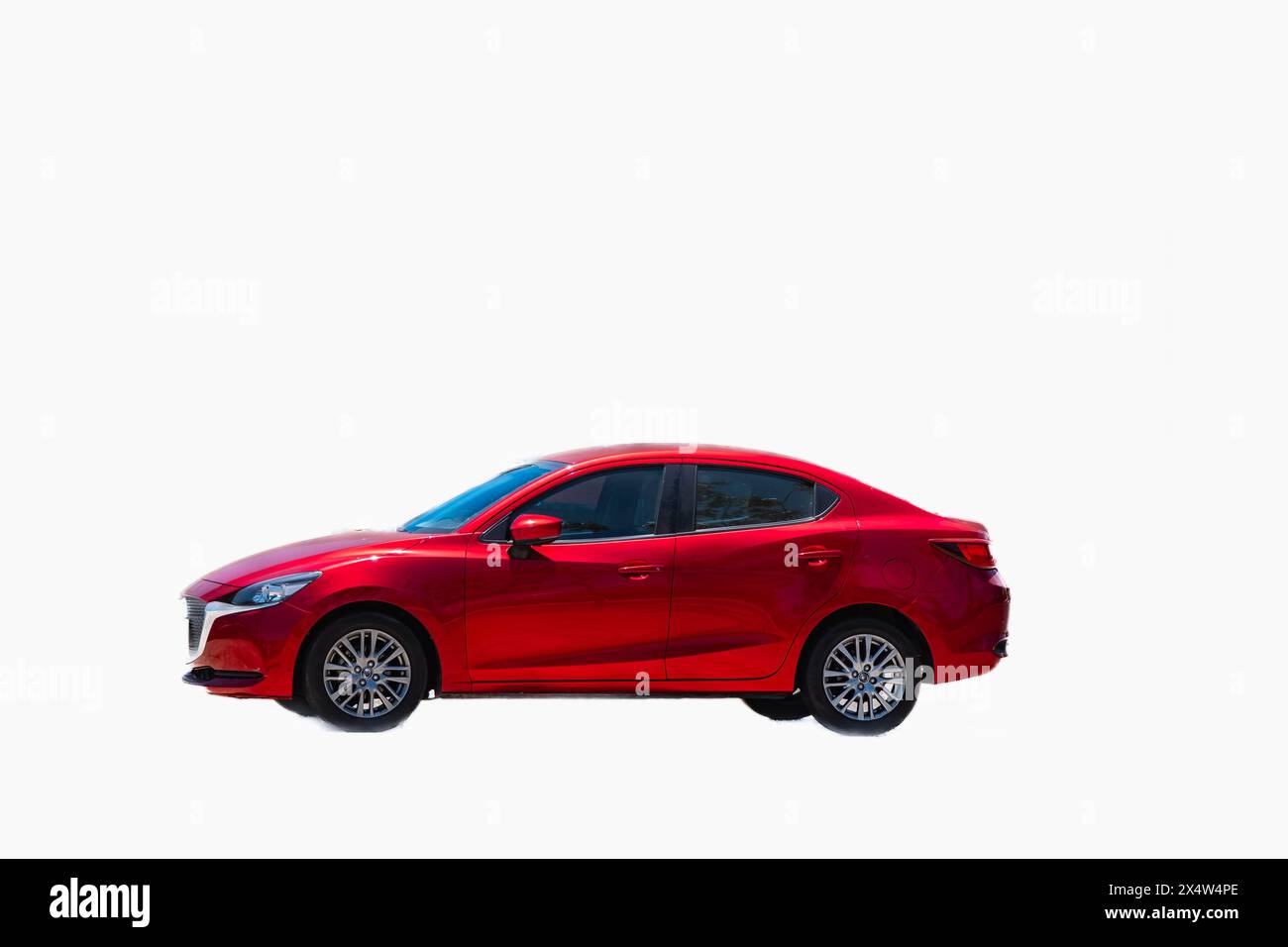 Red car isolated on white background. Stylish car New 4-door hybrid sedan car. Modern family hybrid car red on a white background Stock Photo