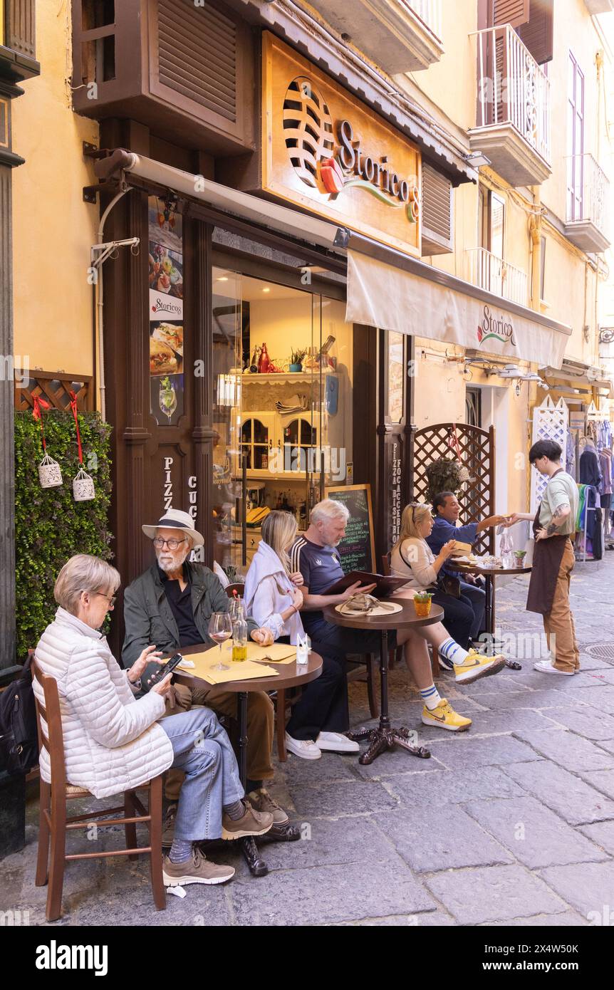 Italy restaurant; People drinking in the street outside Storico restaurant; Sorrento Italy Europe. Italy lifestyle. Stock Photo