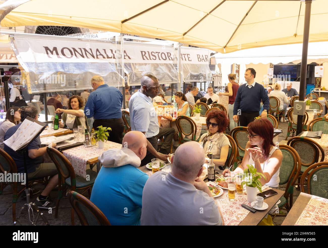Italy restaurant; customers eating outdoors at the Monnalisa restaurant, in summer, Sorrento Italy Europe Stock Photo