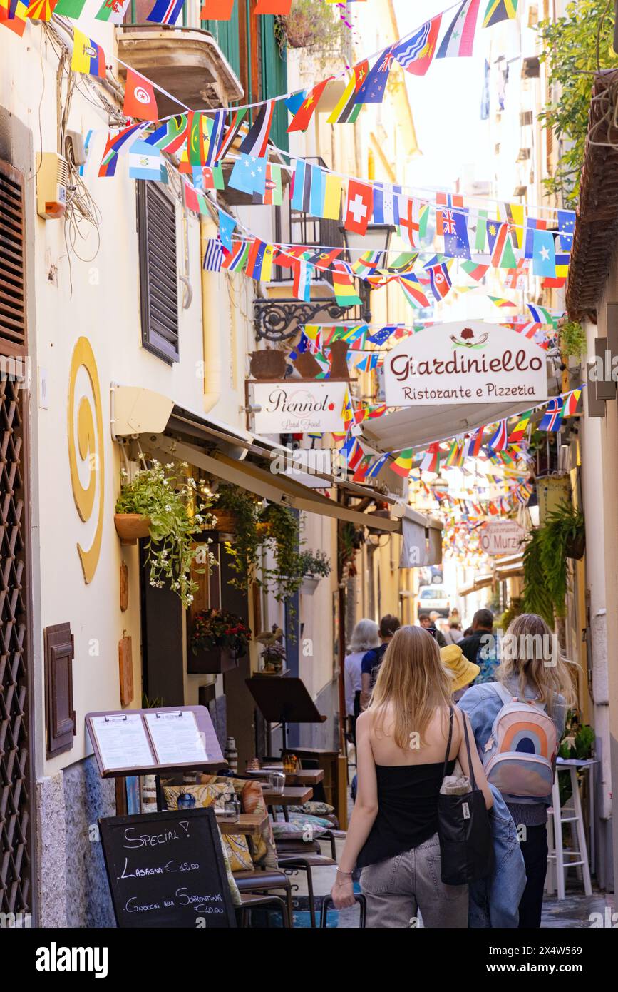 Colourful Sorrento street scene with narrow streets, flags and bunting on a sunny summer day, Sorrento Italy Europe Stock Photo