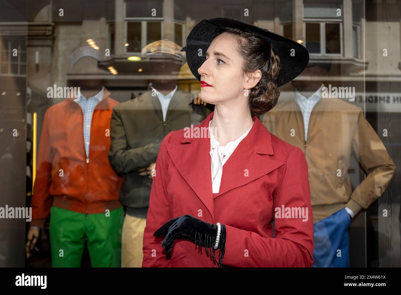 London, UK.  5 May 2024.  An elegantly dressed woman takes part in the fourth Grand Flâneur walk. Starting at the Beau Brummell statue on Jermyn Street, the walk coincides with the 25th anniversary of The Chap magazine and is defined as a walk without purpose, celebrating the art of the flâneur, oblivious to going anywhere specific, and an antidote to the demands of modern life and the digital smartphone.  Credit: Stephen Chung / Alamy Live News Stock Photo