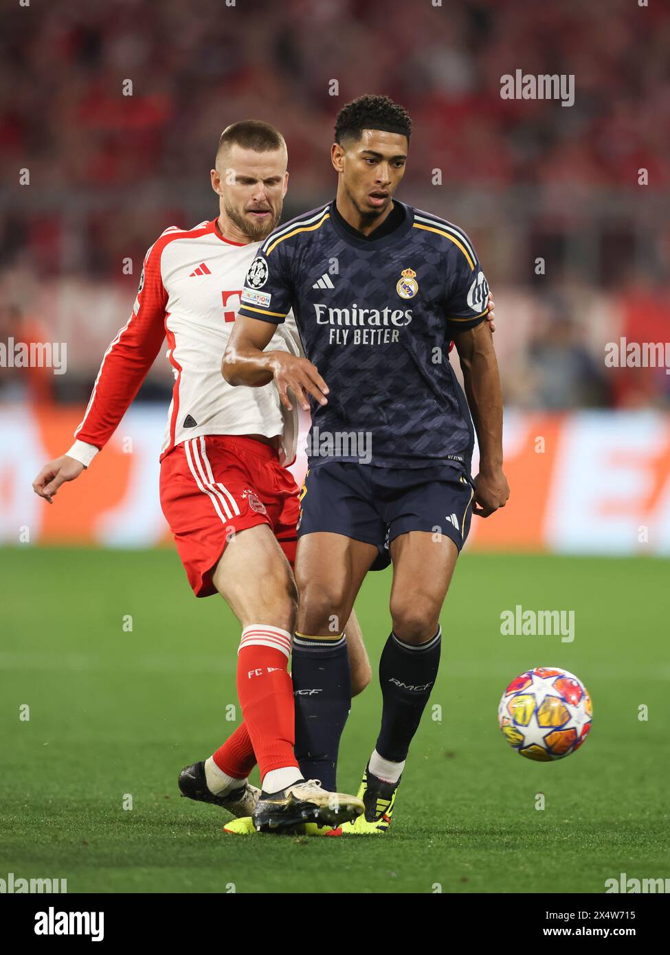 MUNICH, GERMANY - APRIL 30: Eric Dier of Bayern Muenchen vies with Jude Bellingham of Real Madrid during the UEFA Champions League semi-final first leg match between FC Bayern München and Real Madrid at Allianz Arena on April 30, 2024 in Munich, Germany. © diebilderwelt / Alamy Stock Stock Photo