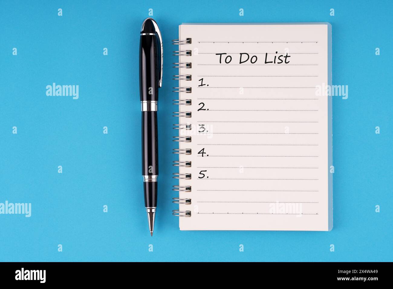 To do list text on notepad on blue background Stock Photo