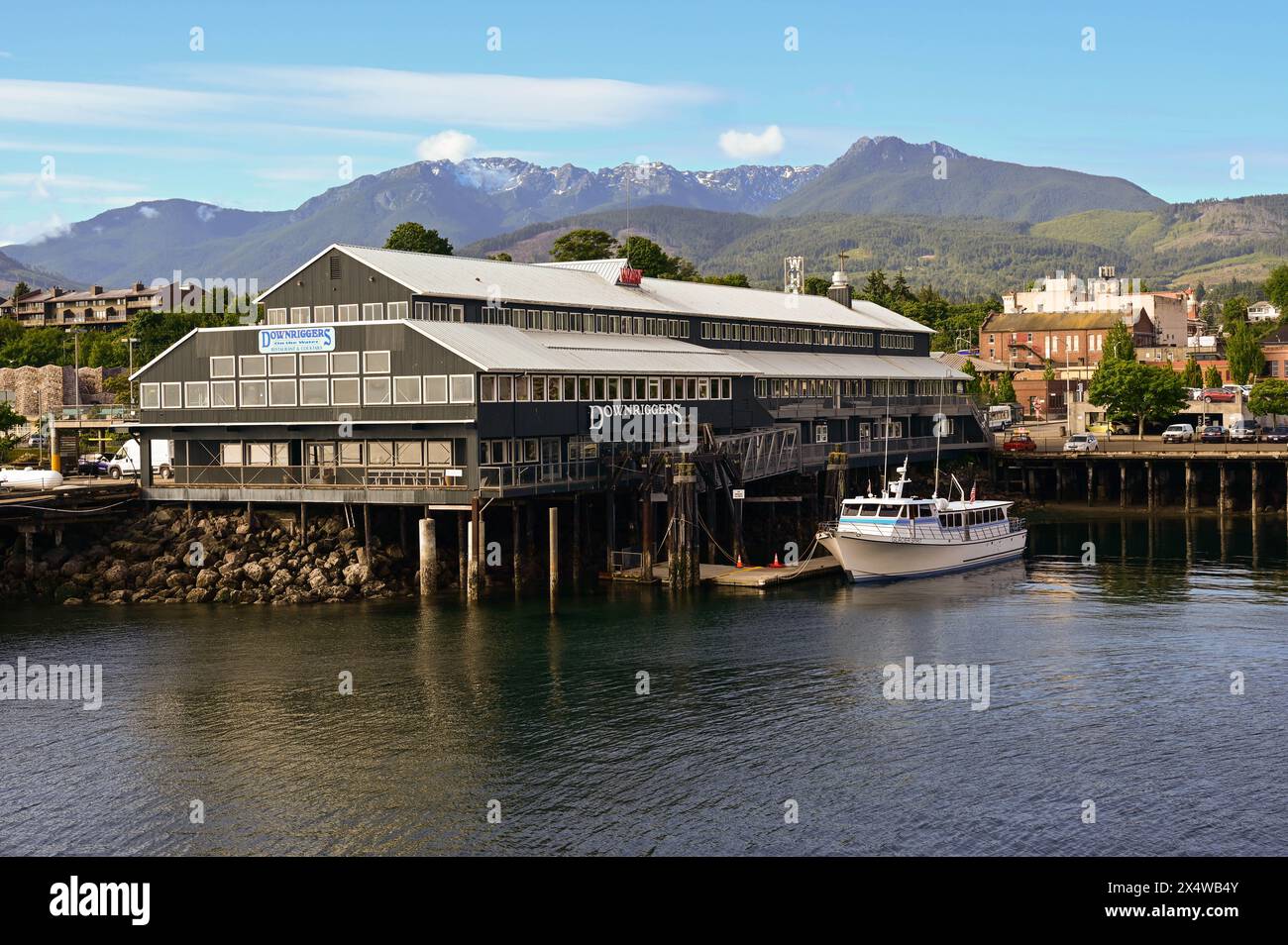 View Of Port Angeles Waterfront With The Olympic Mountains In The view-of-port-angeles-waterfront-with-the-olympic-mountains-in-the