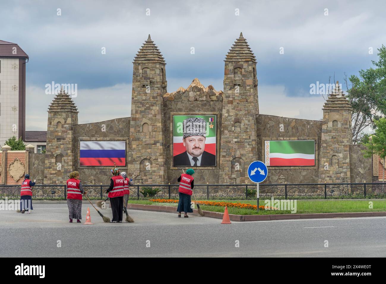 The portrait of Chechen Republic ex-president Akhmad Kadyrov, Russian and Chechen flags on the decorative towers in the Grozny city in Russia. Stock Photo