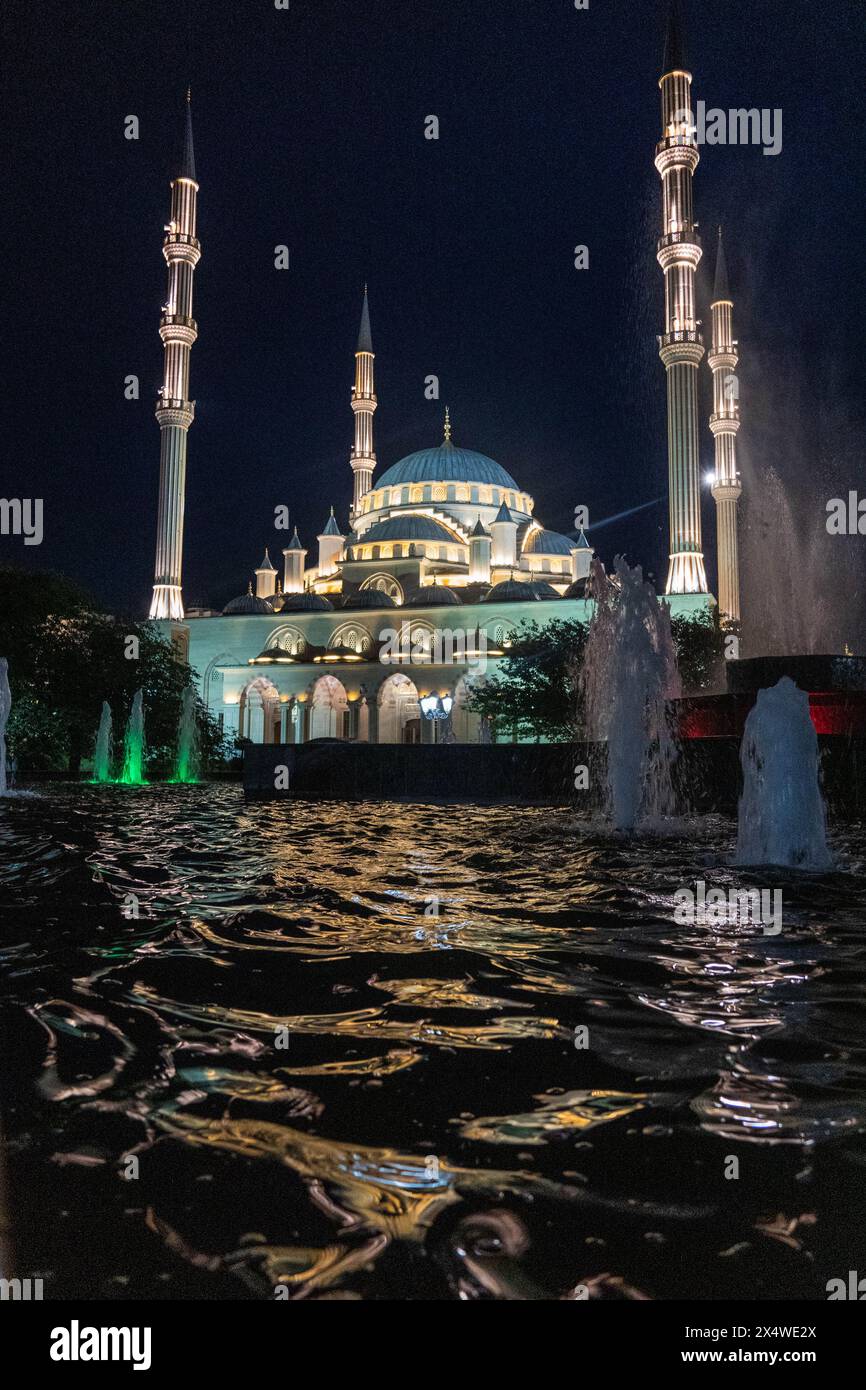The fountains in front of the 'Heart of Chechnya' mosque in the downtown of Grozny, the capital of Chechen Republic, Southern Russia, during the night Stock Photo