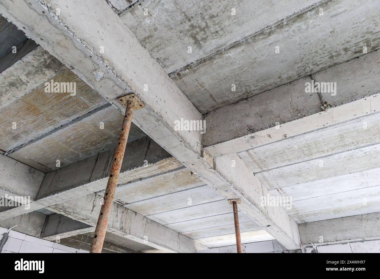 building under construction with iron steel support concrete beams building under construction with iron steel support concrete beams