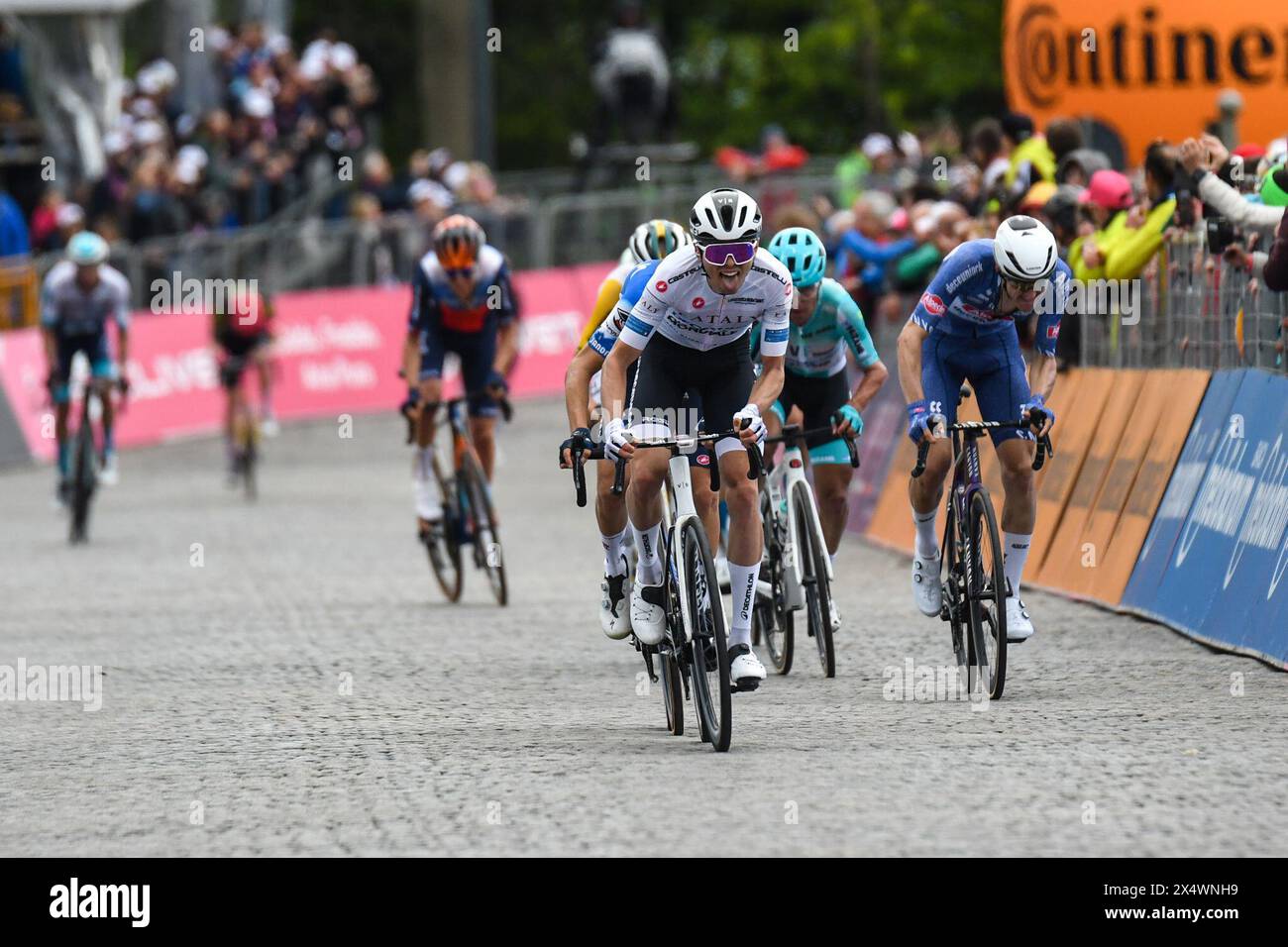 Biella, Italy. 05th May, 2024. the group reaches to finih line of San Francesco Al Campo (TO)-Santuario di Oropa (BI) - Stage 2 of Giro D'Italia 2024 during Stage 2 - S.Francesco al Campo-Santuario di Oropa, Giro d'Italia race in Biella, Italy, May 05 2024 Credit: Independent Photo Agency/Alamy Live News Stock Photo