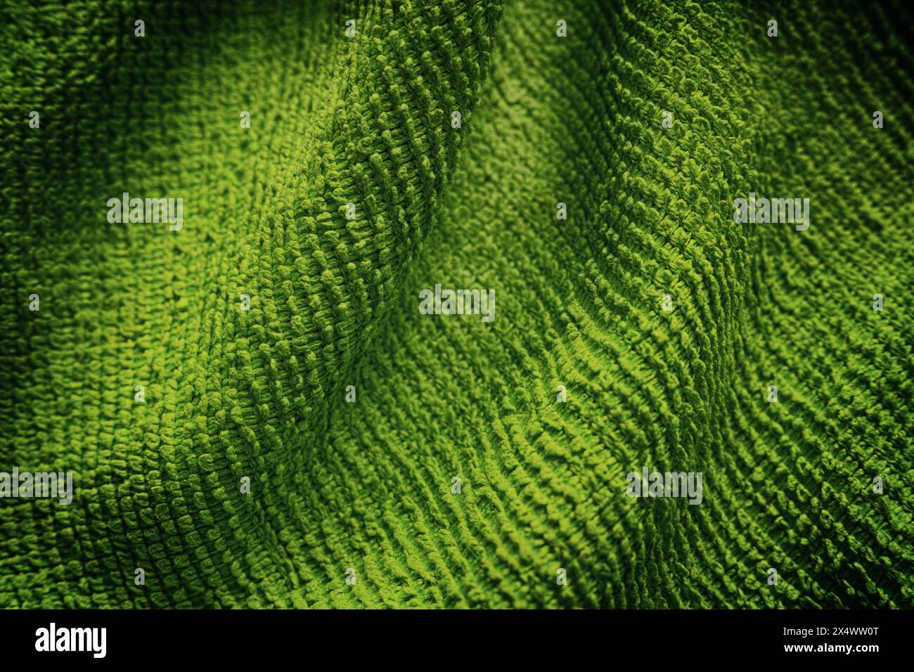 A green microfiber cleaning towel texture background. Close up. Stock Photo