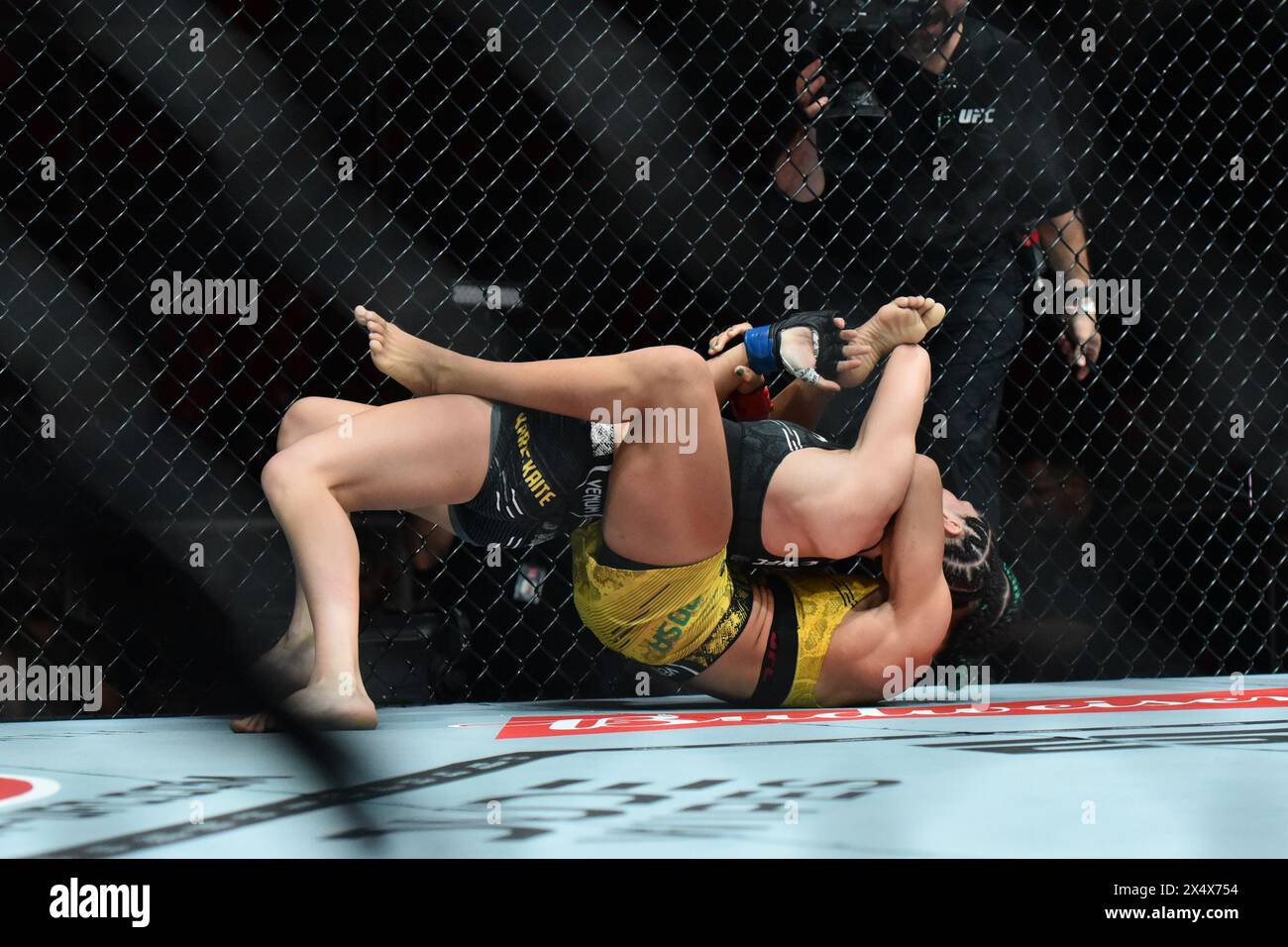 Rio De Janeiro, Rj, Brazil. 04th May, 2024. RIO DE JANEIRO, RJ - MAY 4: Dione Barbosa (red gloves) battles Ernesta Kareckaite (blue gloves) in their women's flyweight fight during the UFC 301 event at Farmasi Arena on May 4, 2024 in Rio de Janeiro, RJ, Brazil. (Photo by Leandro Bernardes/PxImages) Credit: Px Images/Alamy Live News Stock Photo