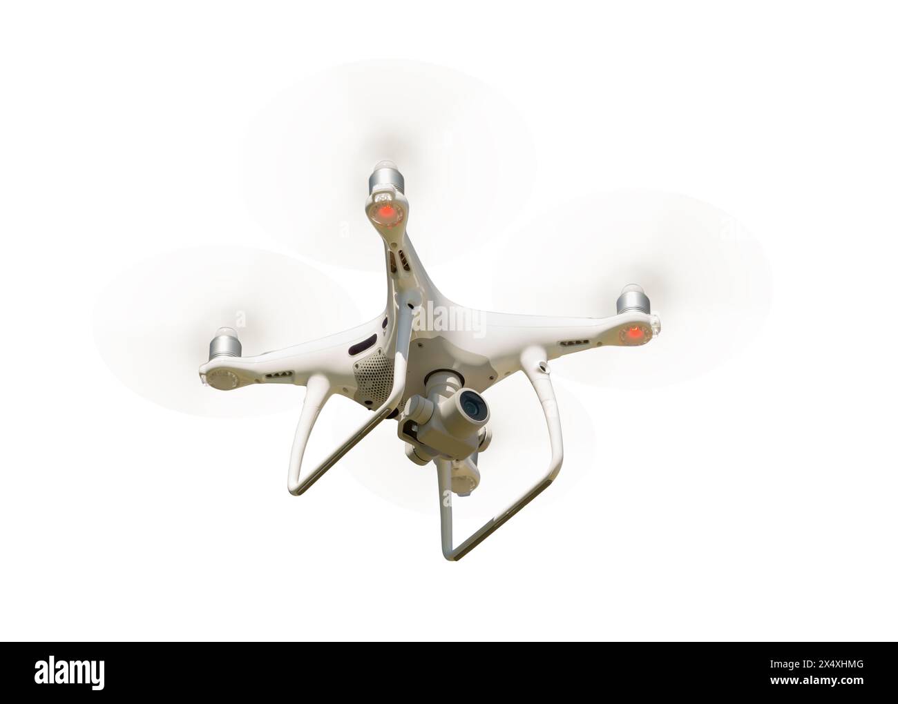 Unmanned Aircraft System (UAV) Quadcopter Drone In The Air Isolated on a White Background. Stock Photo