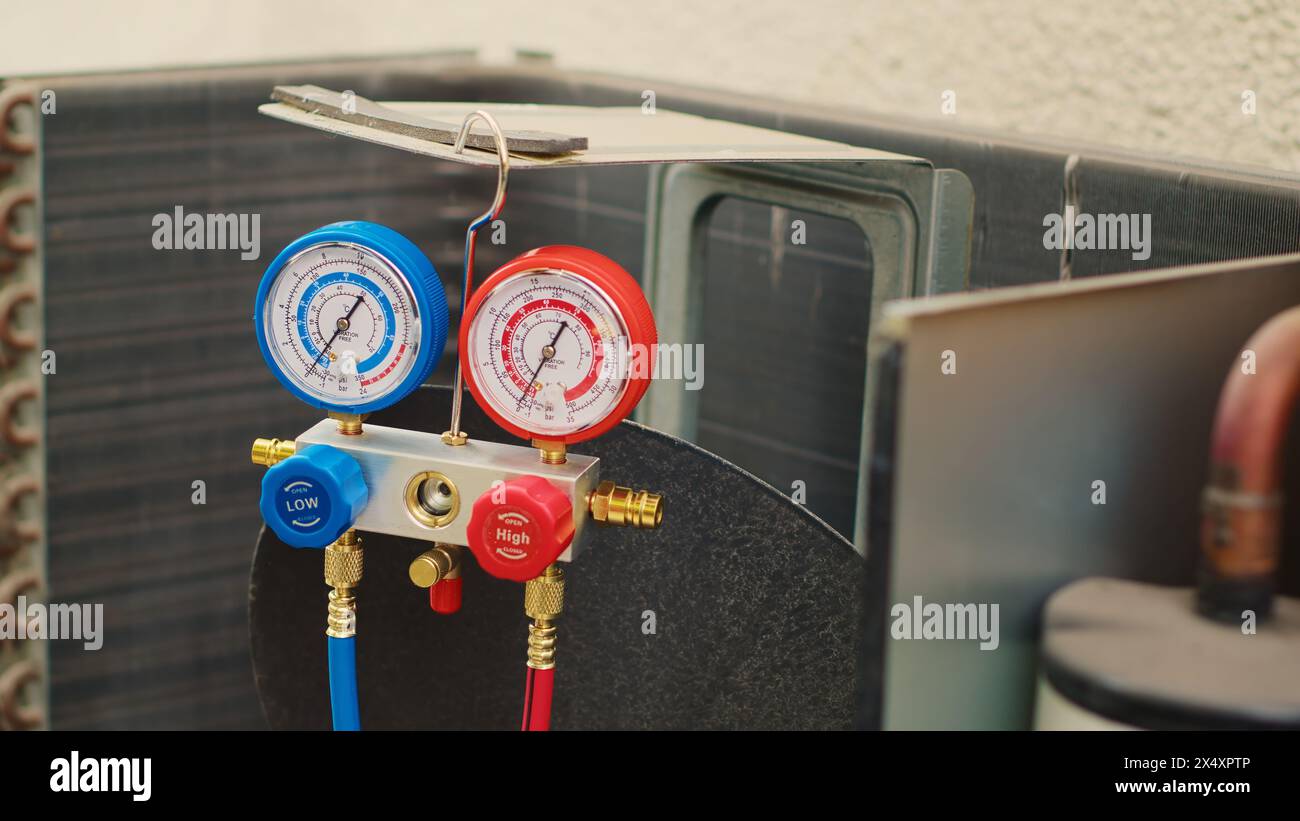 Zoom out shot of broken pressure measurement device used for checking hvac system freon pressure