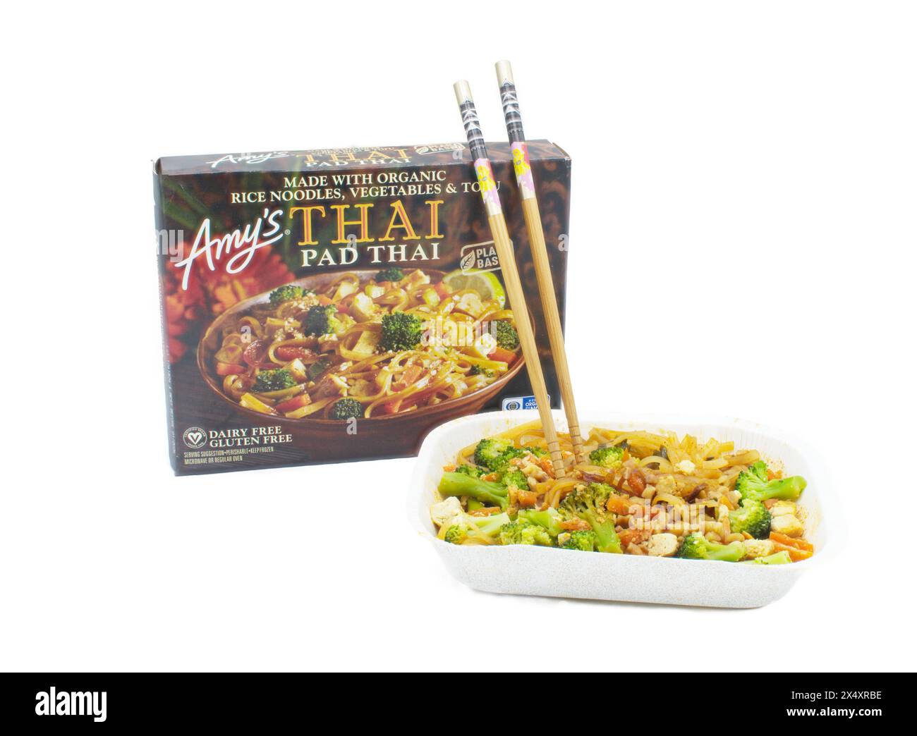 Ocala, FL 4-14-2024 Amys Pad Thai box container and cooked meal with chopsticks made with organic rice noodles, vegetables and tofu, plant based dairy Stock Photo