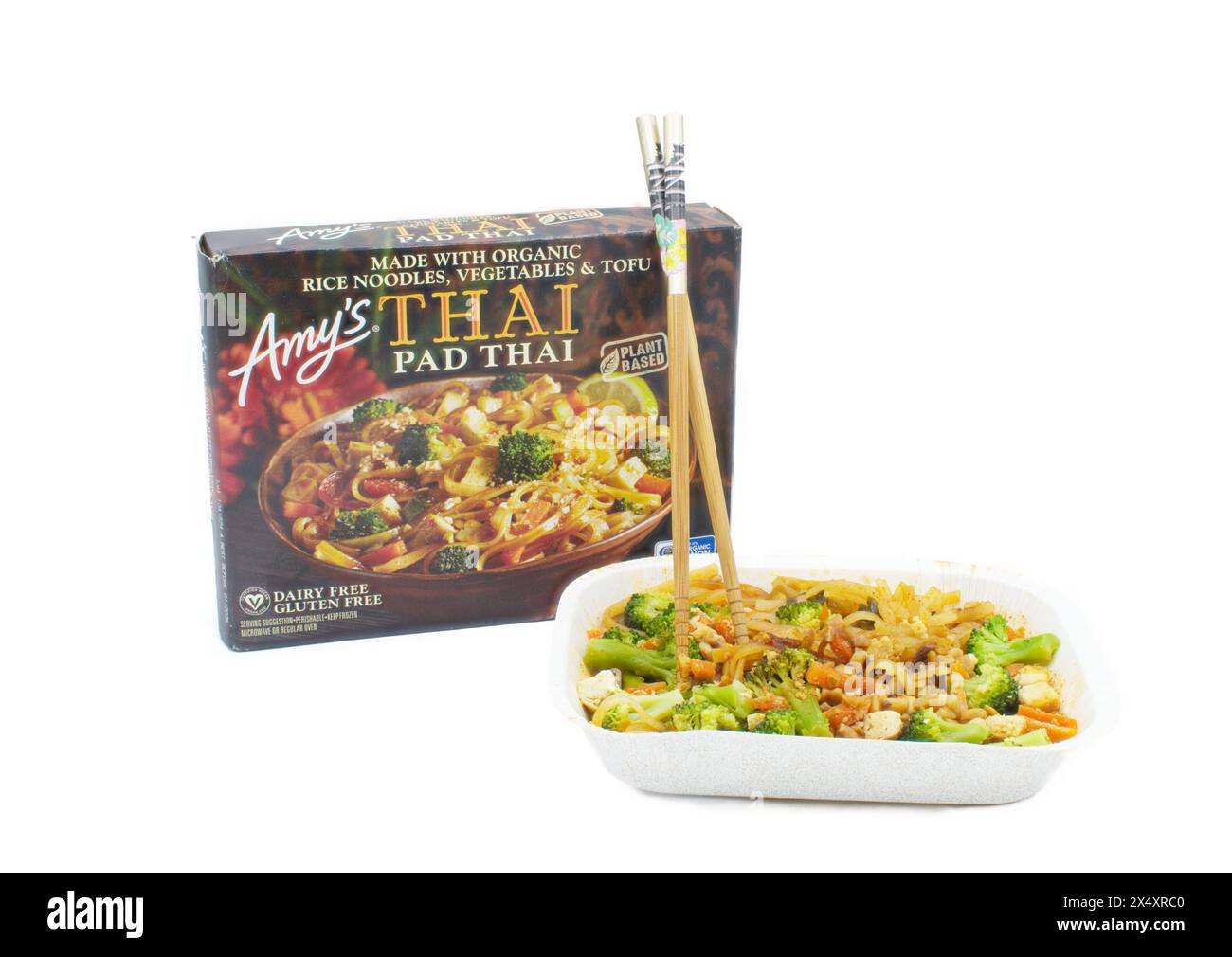 Ocala, FL 4-14-2024 Amys Pad Thai box container and cooked meal with chopsticks made with organic rice noodles, vegetables and tofu, plant based dairy Stock Photo