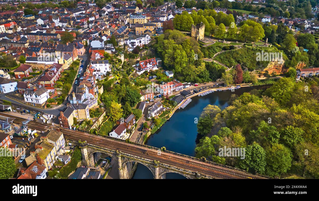 Aerial view of a picturesque town with a river flowing through ...