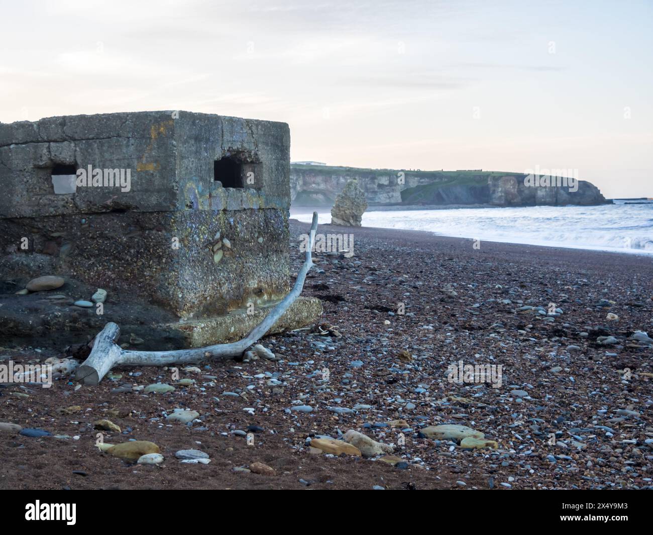 Abandoned Pillbox and Driftwood at Blast Beach, Seaham, County Durham, UK Stock Photo