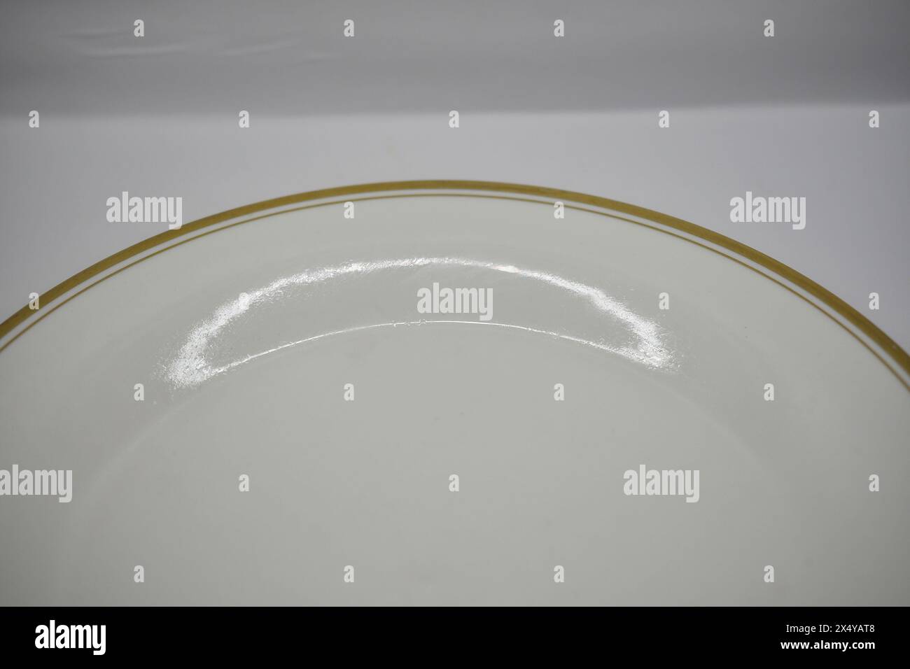 White dinner plate with gold rim stock photo alamy