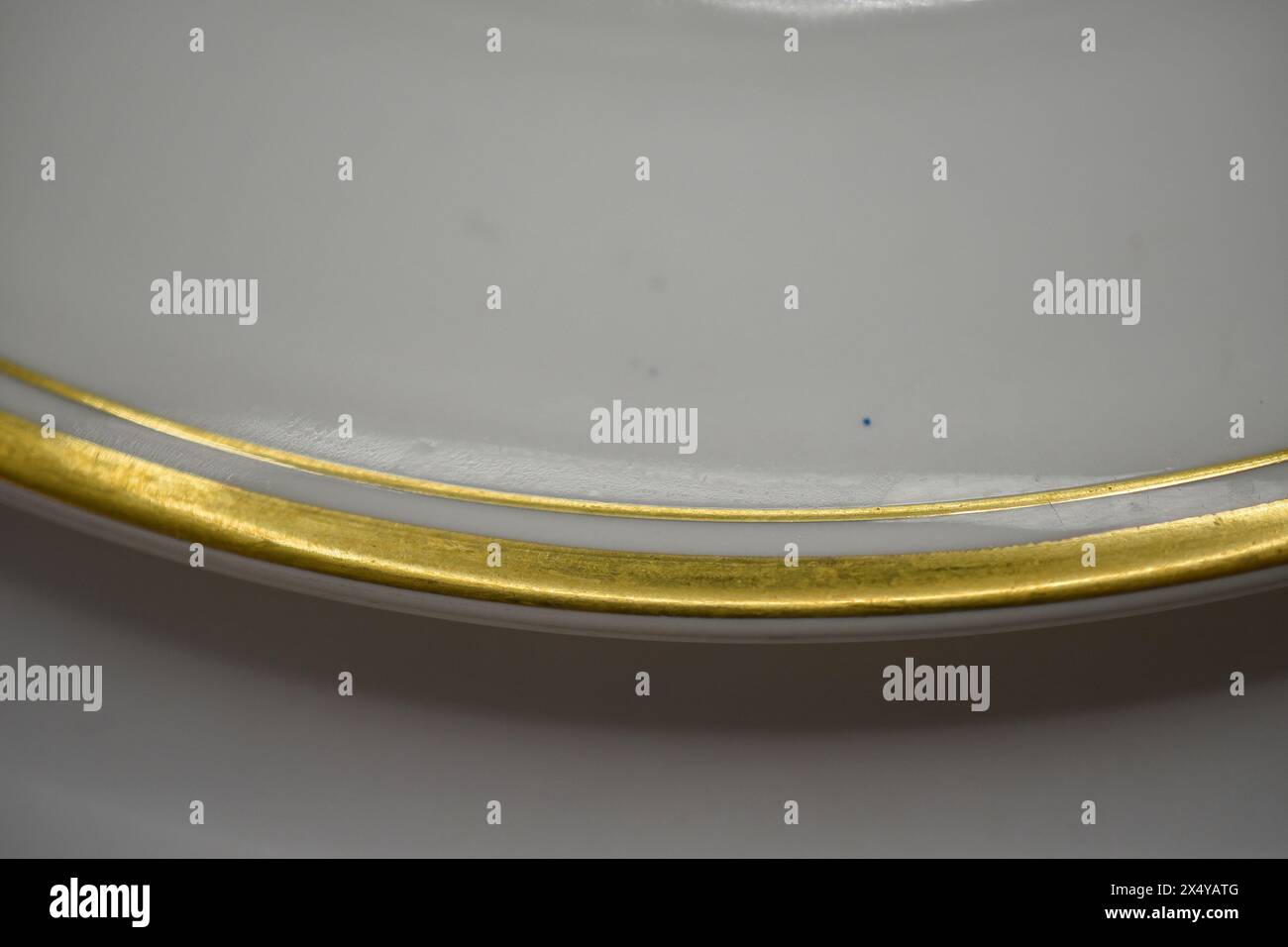 White dinner plate with gold rim stock photo alamy