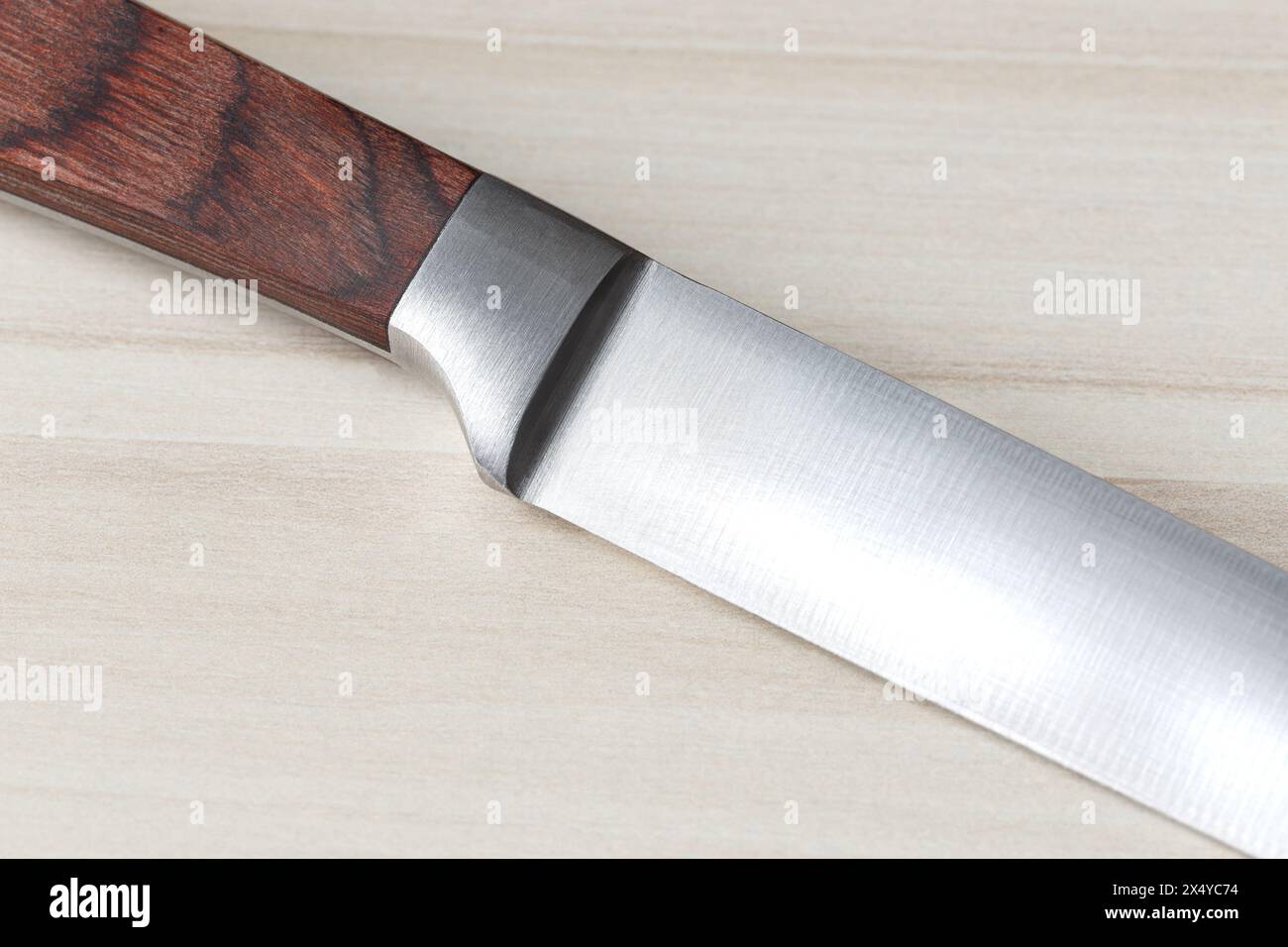 Fragment of an ordinary kitchen knife with a brown wooden handle Stock ...