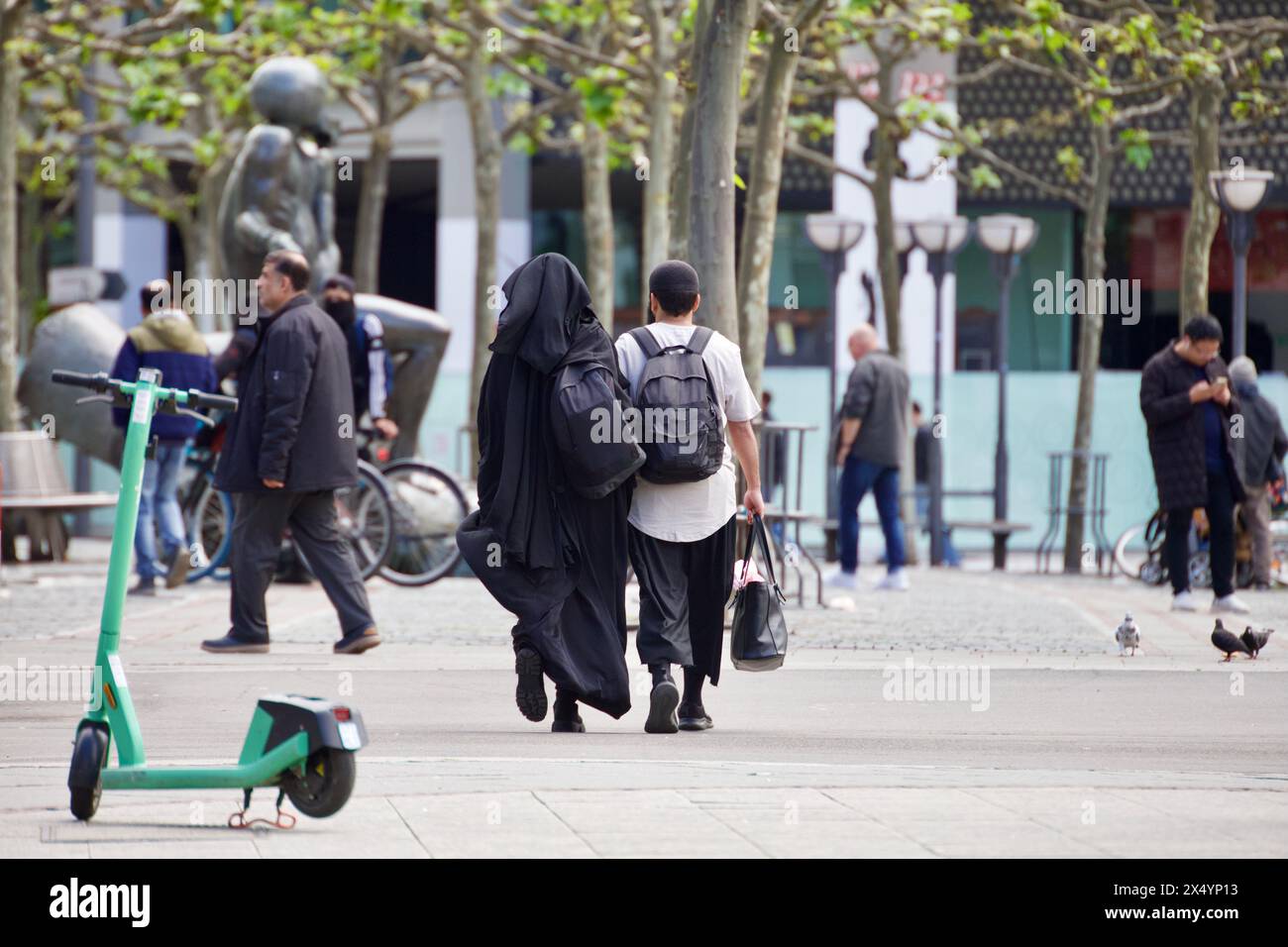 Frankfurt am Main, Germany, May 05, 2024. A Muslim couple walk on the streets of Hauptwache, the
