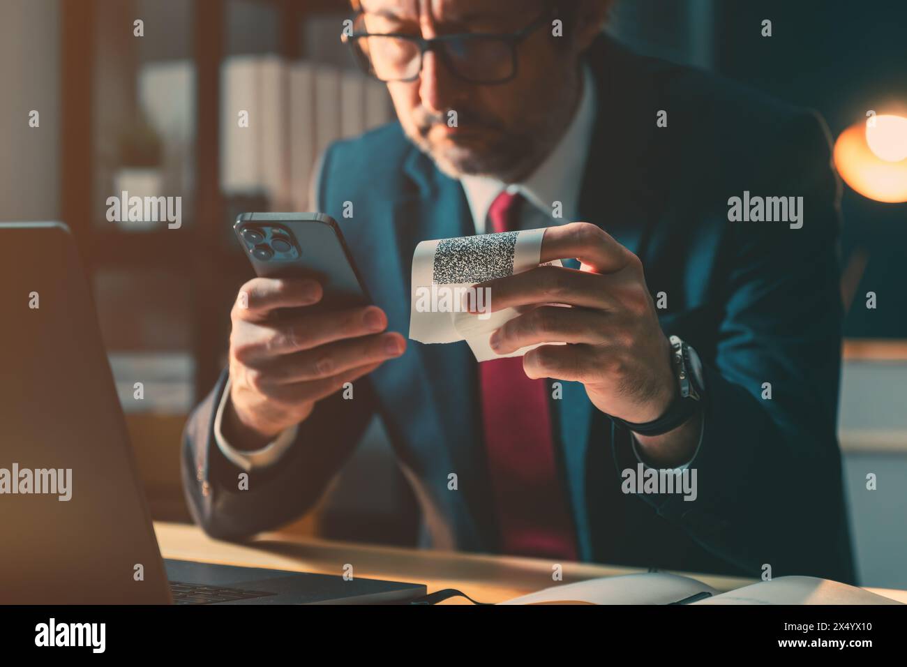 Financial ombudsman checking fiscal receipt issued to customer as proof of purchase for goods or services, selective focus Stock Photo