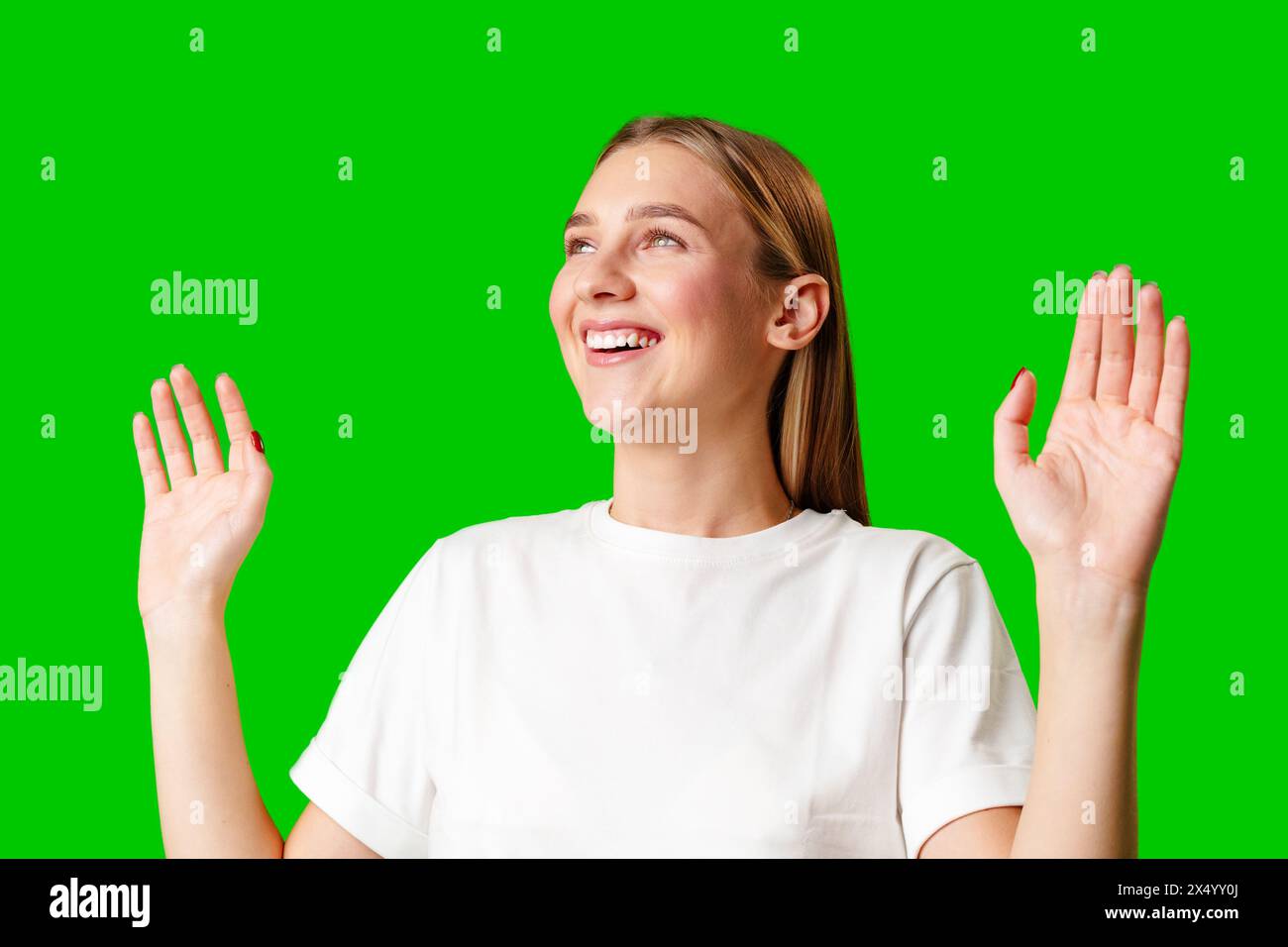 Young Woman in White T-shirt Making a Surprised Face Stock Photo