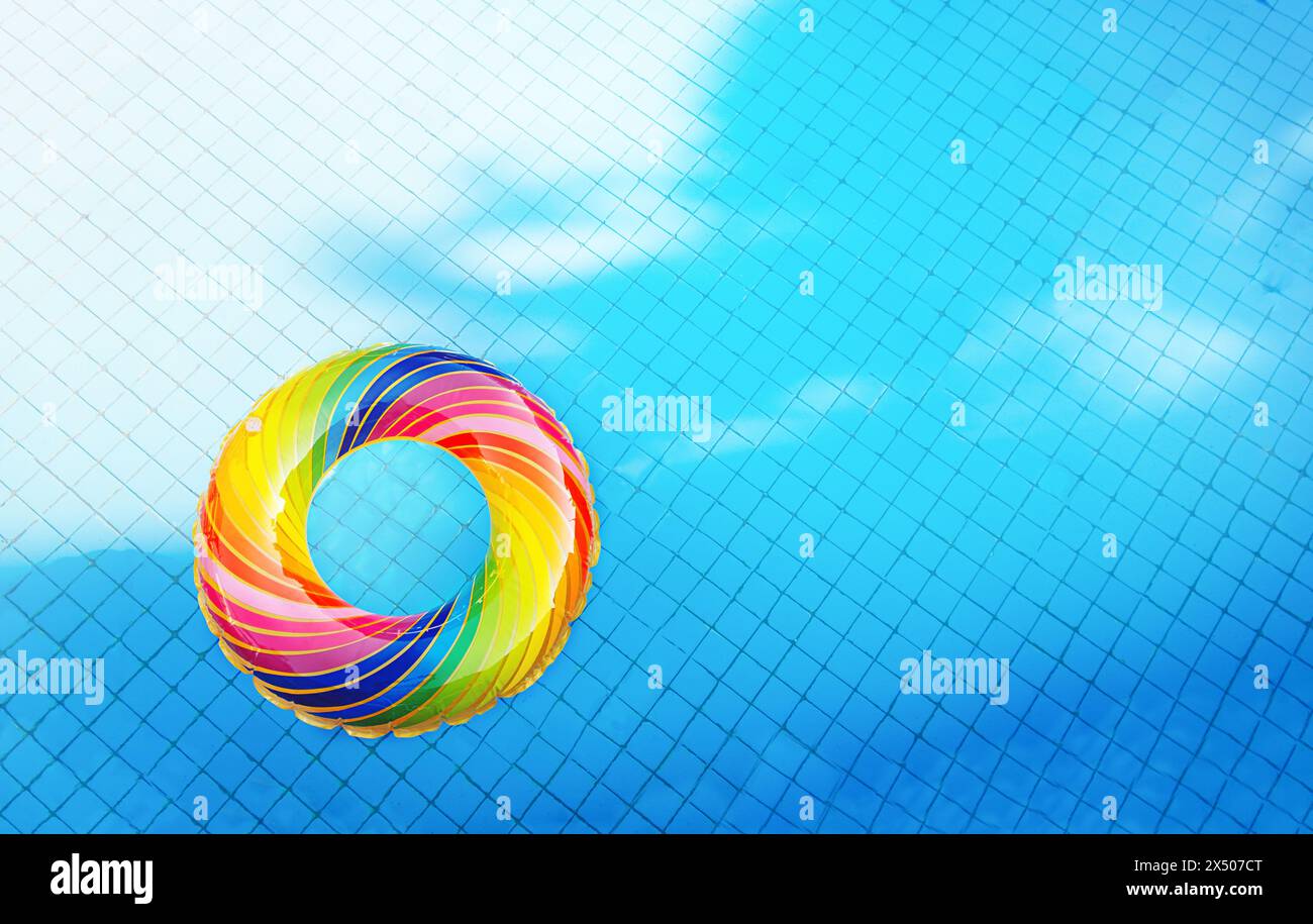 Inflatable ring in the pool water. Summer vacation background Stock Photo