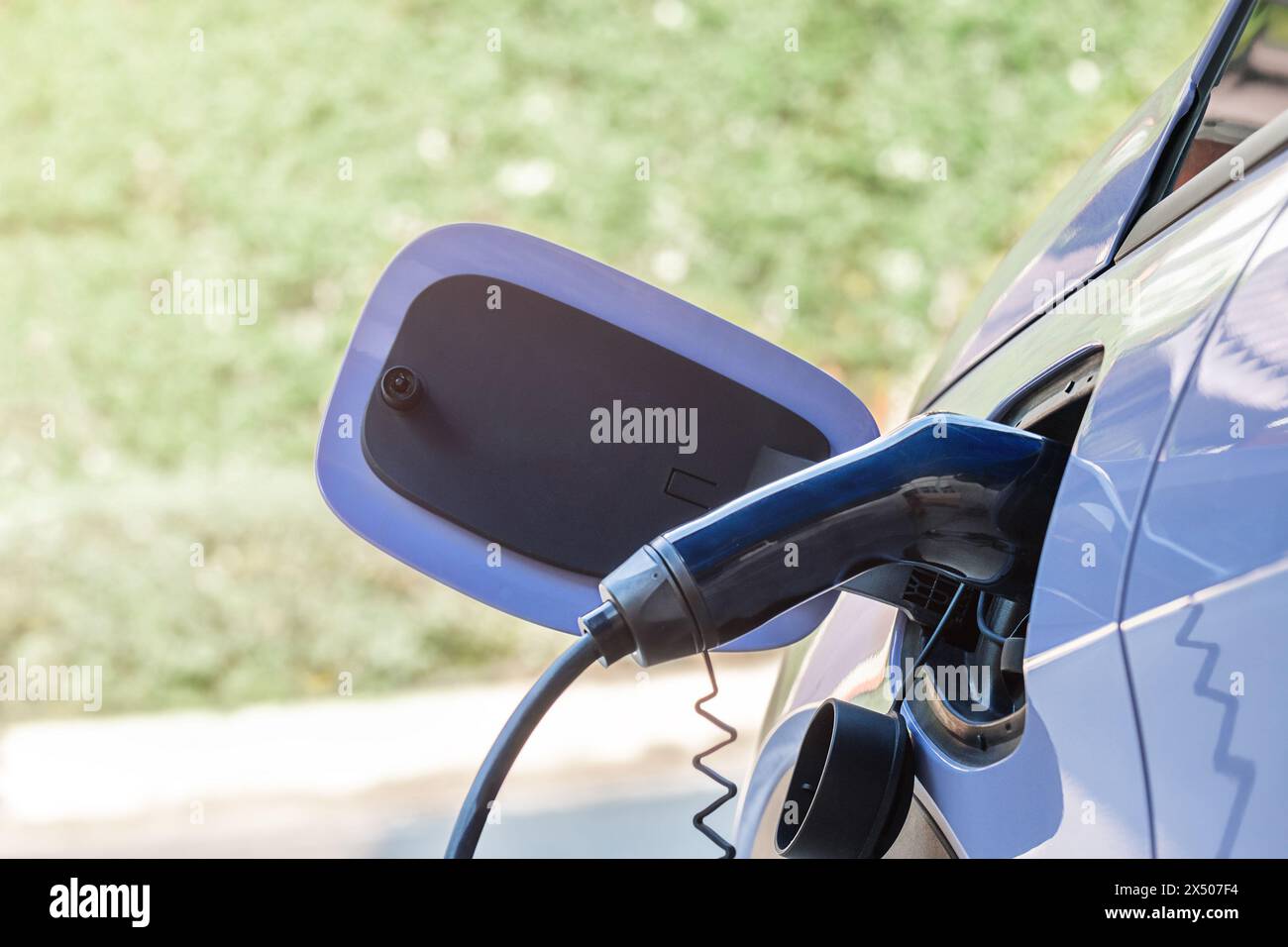 The electric car charging close-up outdoors Stock Photo