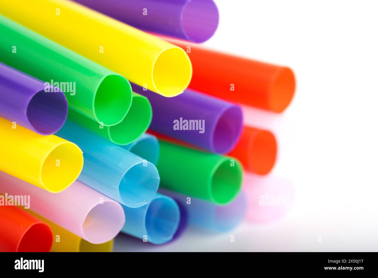 Colorful plastic drinking straws on white background. Close up Stock Photo