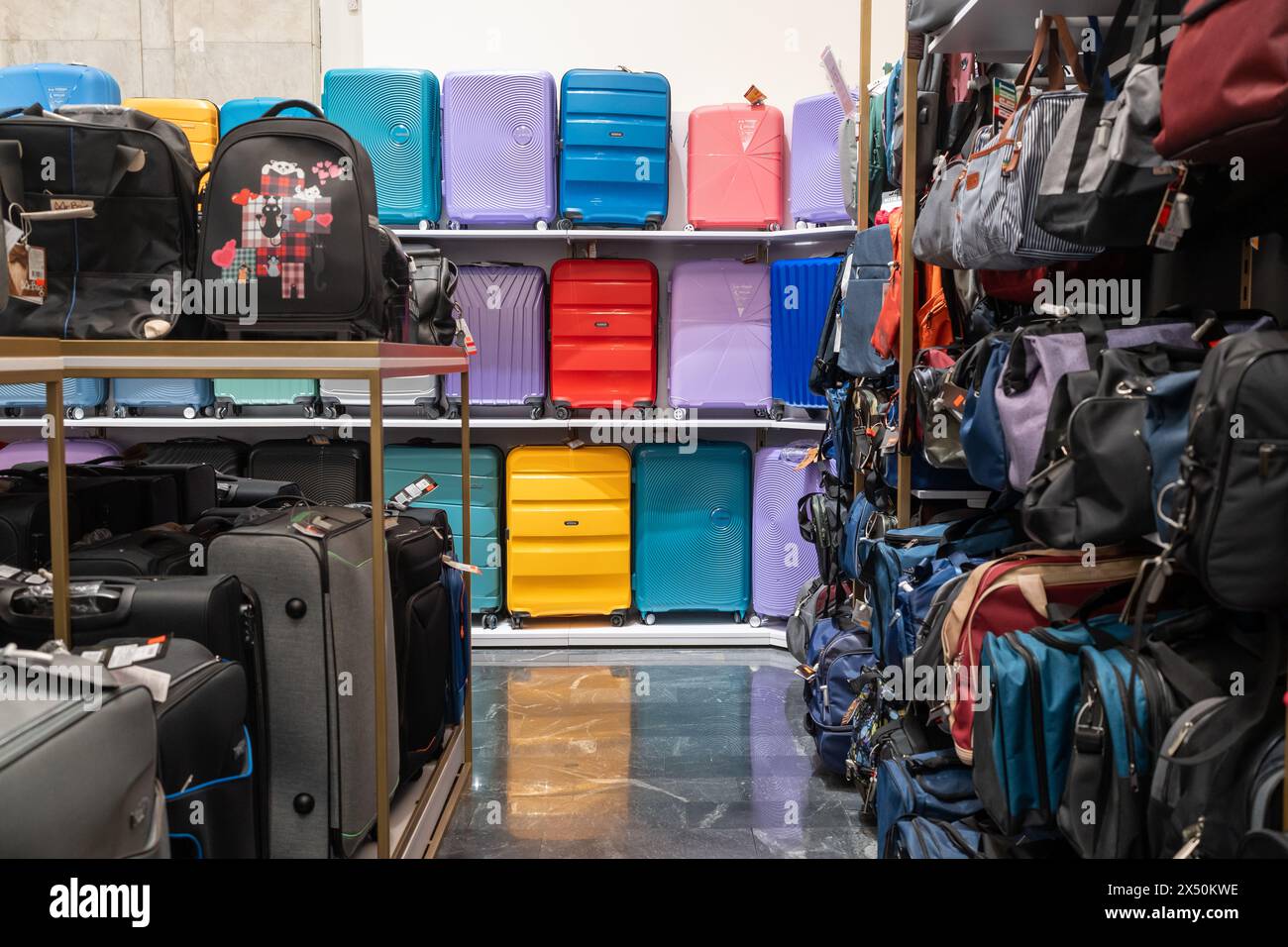Large selection of bags and suitcases in the store. Travel suitcases